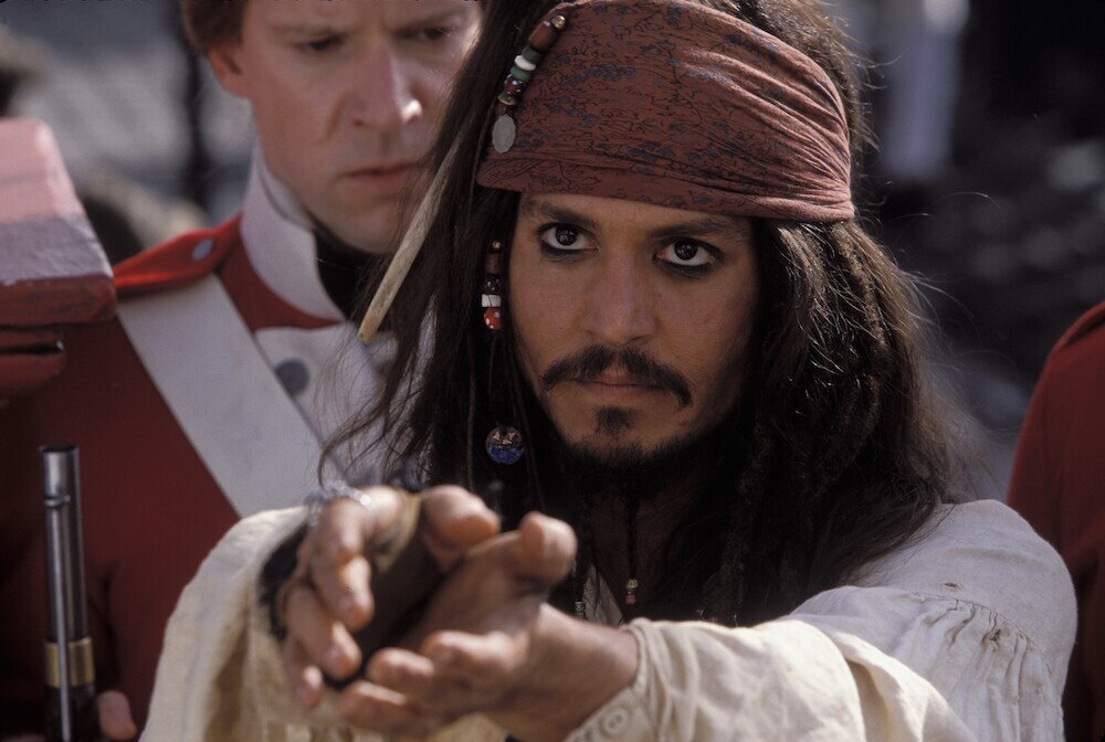 Jack Sparrow (Johnny Depp) captured by soldiers in "Pirates of the Caribbean"