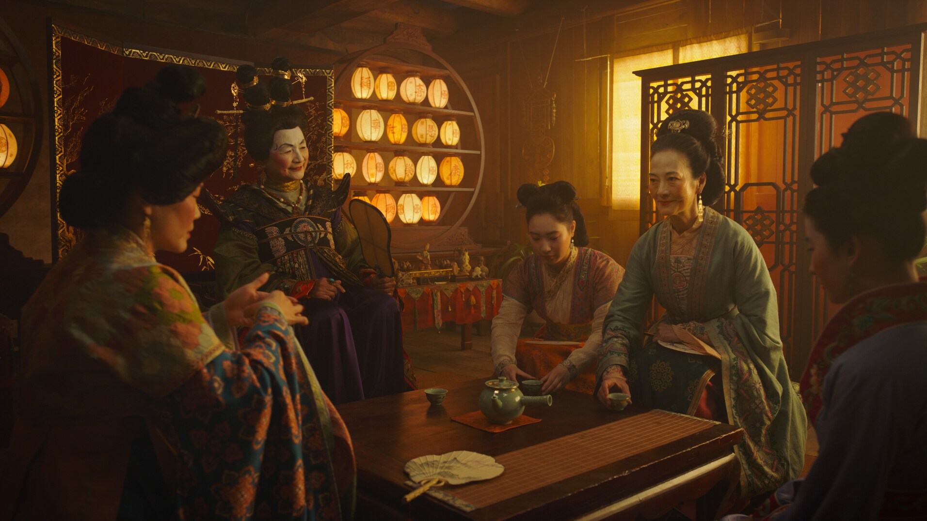 Disney's MULAN..L to R: Groom's mother, Matchmaker (Pei-Pei Cheng), Xiu (Xana Tang), Wuwei (Rosalind Chao) and Mulan (Yifei Liu)..Photo: Film Frame..© 2019 Disney Enterprises, Inc. All Rights Reserved.