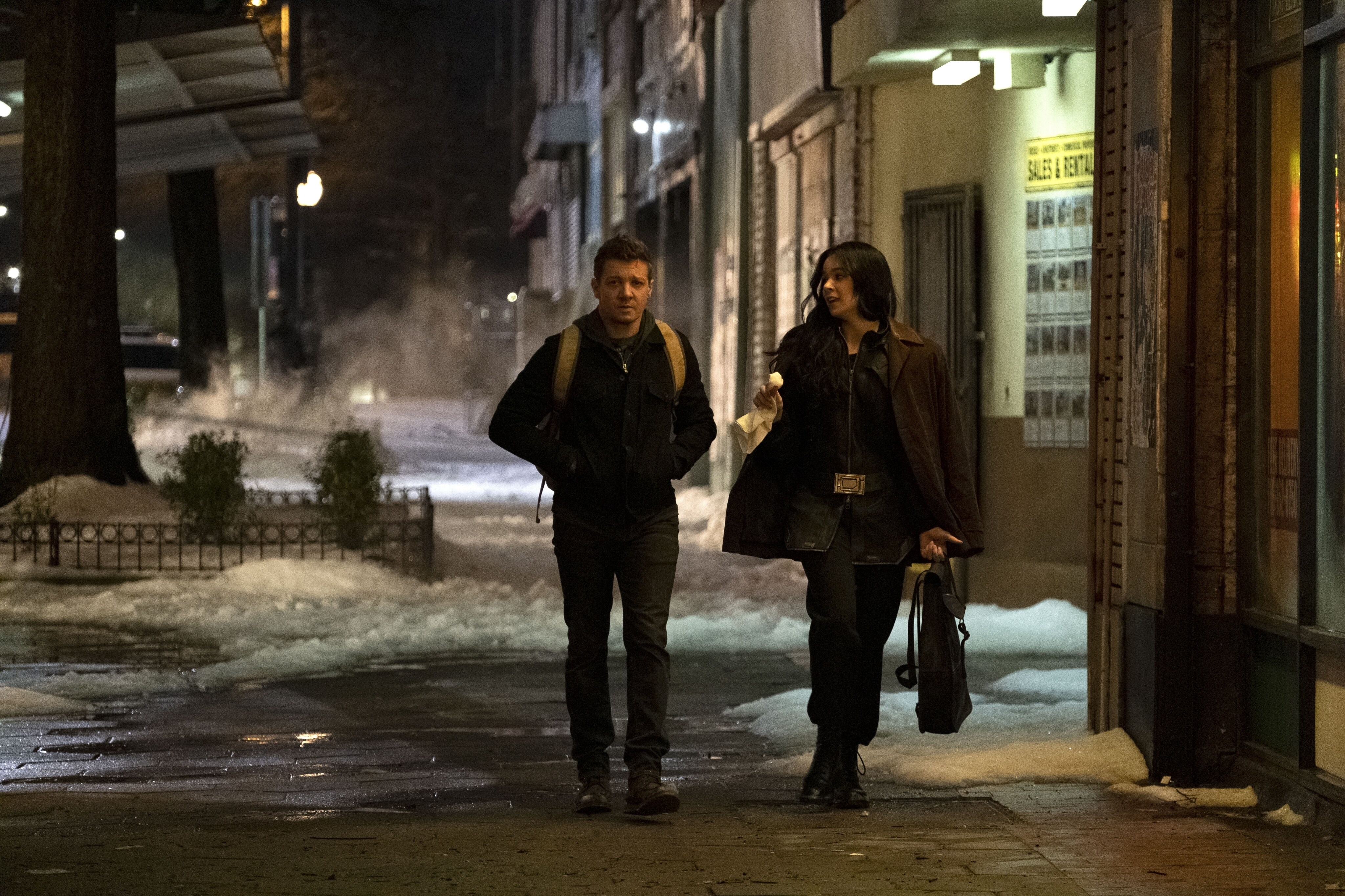 Jeremy Renner as Clint Barton/Hawkeye and Hailee Steinfeld as Kate Bishop in Marvel Studios' HAWKEYE. Photo by Chuck Zlotnick. ©Marvel Studios 2021. All Rights Reserved.