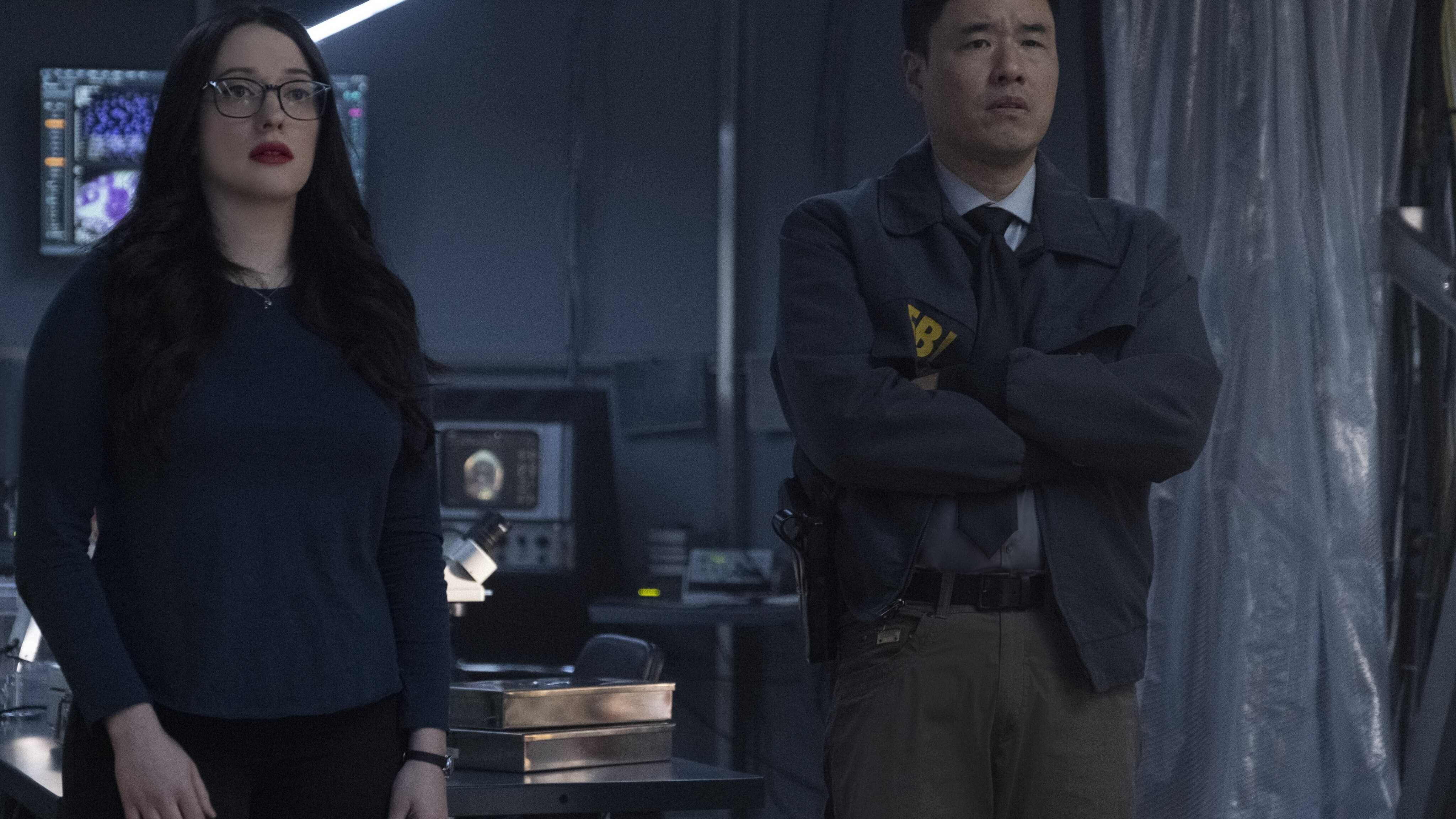 (L-R): Kat Dennings as Darcy Lewis and Randall Park as Jimmy Woo in Marvel Studios' WANDAVISION exclusively on Disney+. Photo by Chuck Zlotnick. ©Marvel Studios 2021. All Rights Reserved.