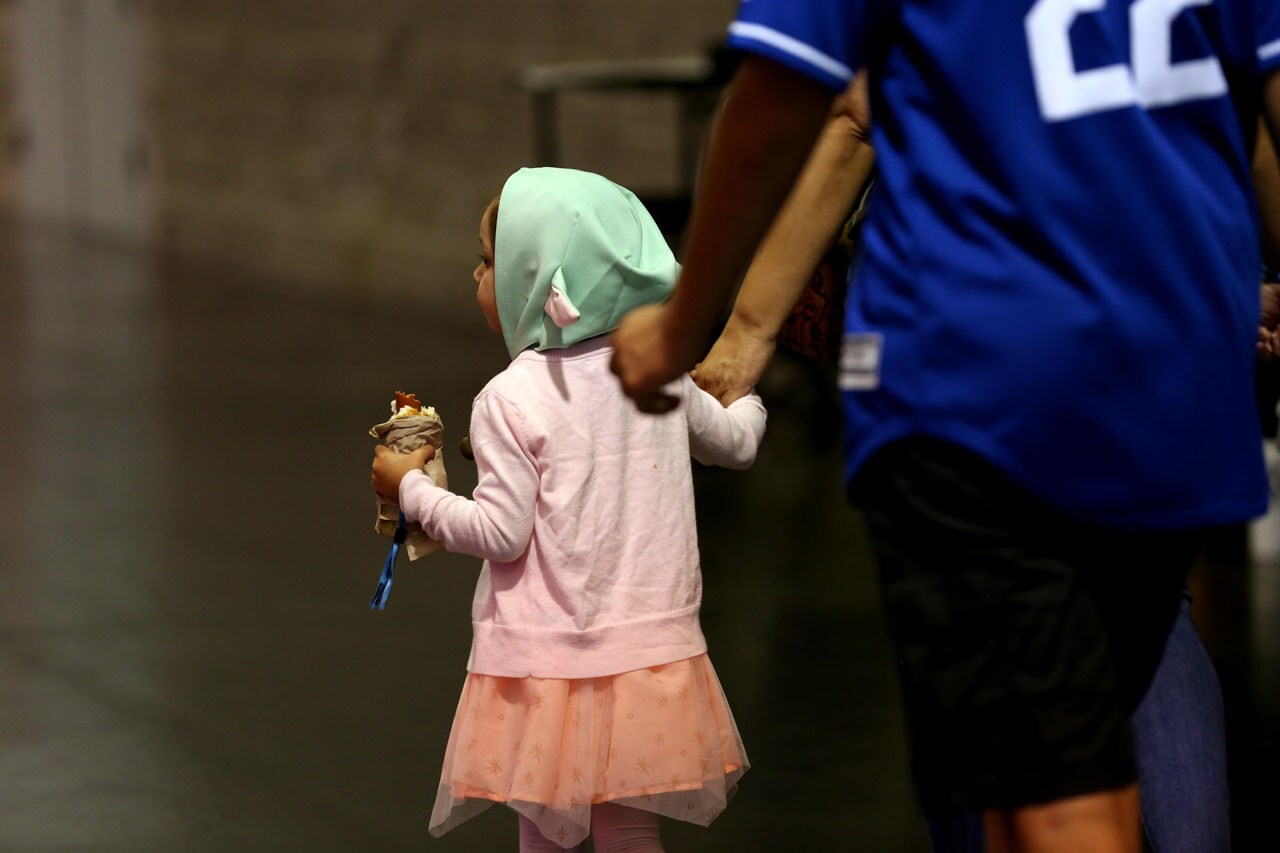 A fan at Star Wars Celebration eating a snack