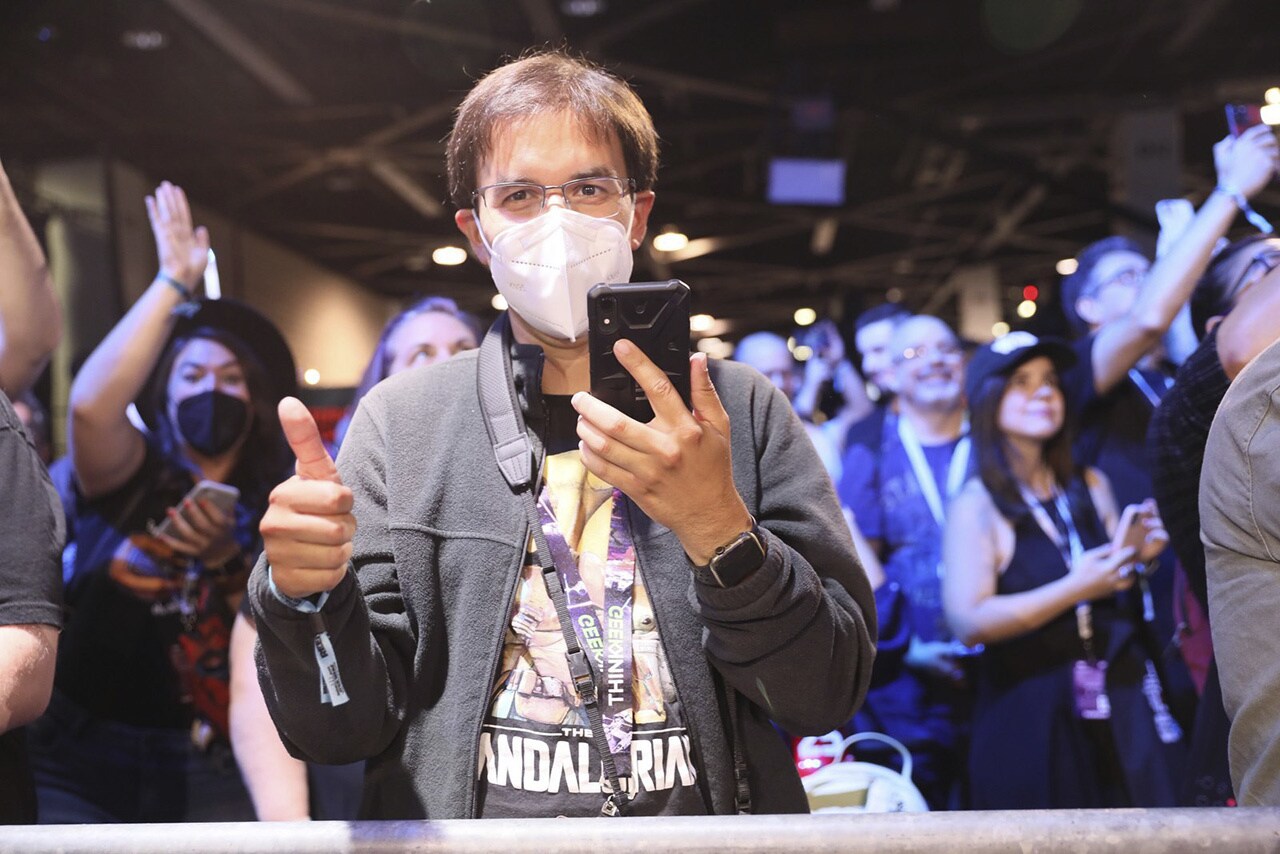 A fan at Star Wars Celebration with their phone