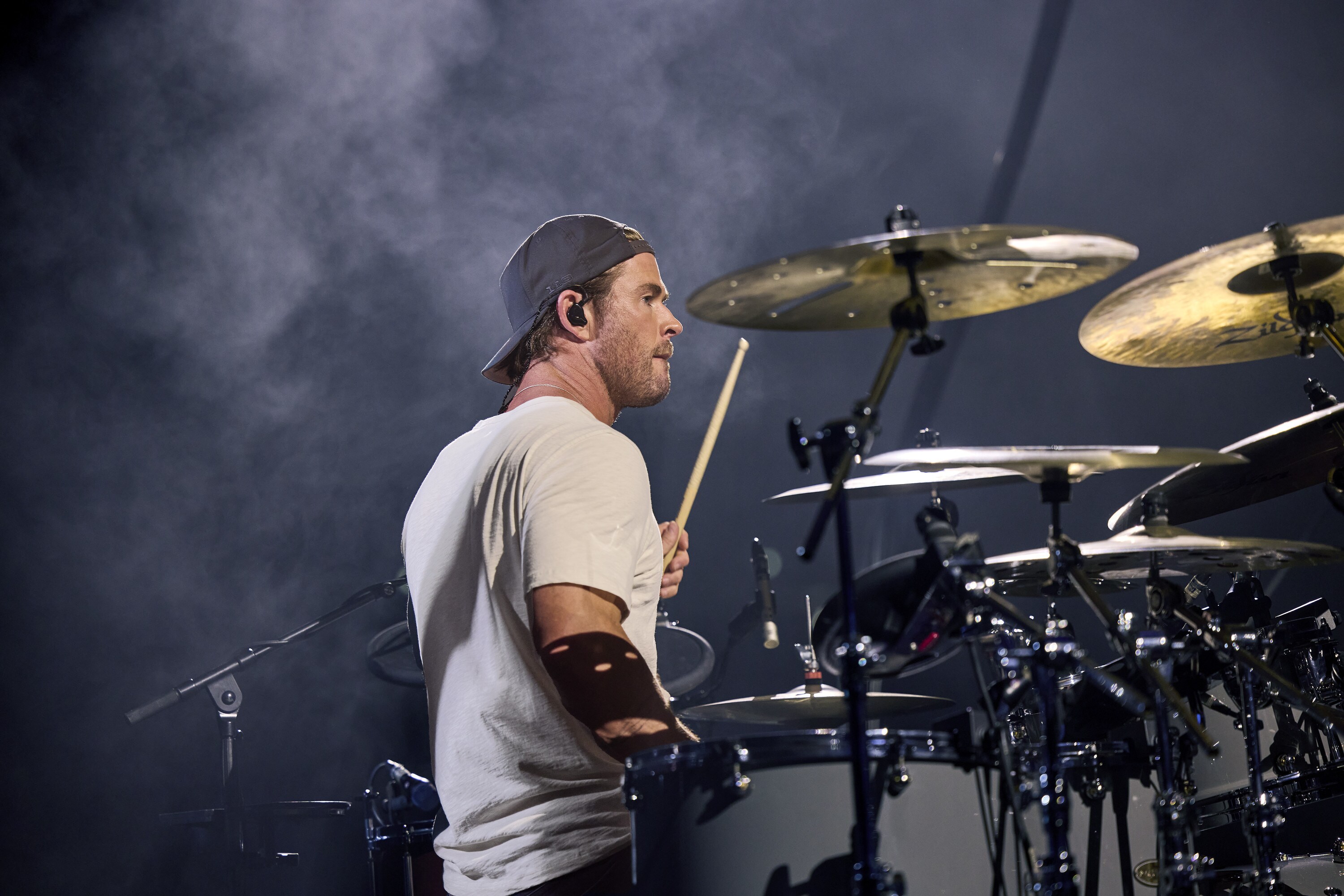 Chris Hemsworth drums during the Ed Sheeran concert in Bucharest. (credit: NationalGeographic/Evan Paterakis)