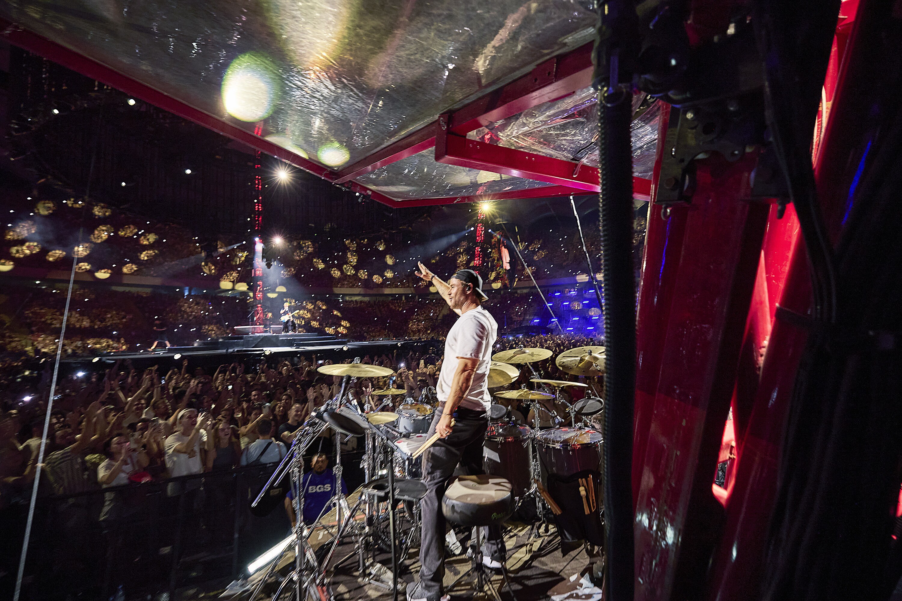 Chris Hemsworth drums during the Ed Sheeran concert in Bucharest. (credit: NationalGeographic/Evan Paterakis)