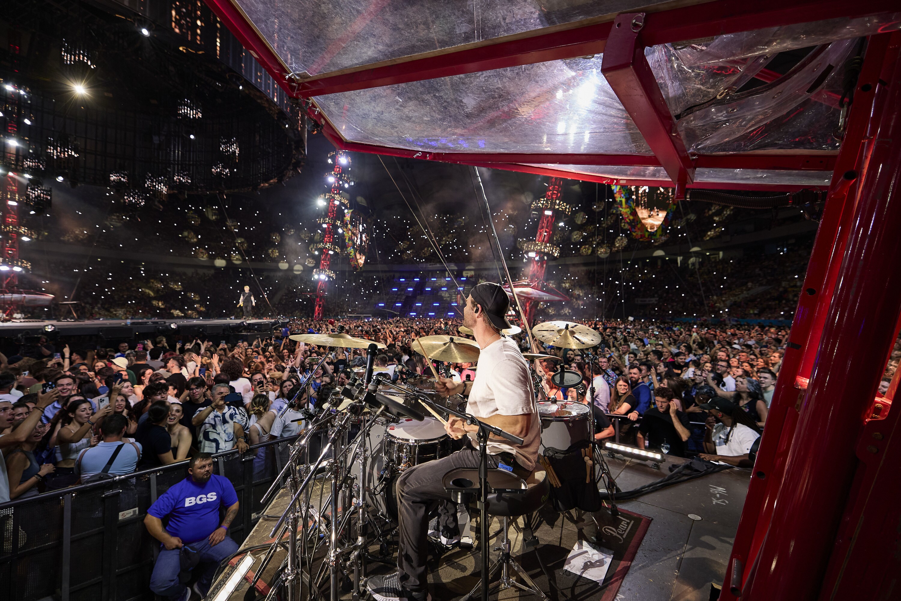 Chris Hemsworth drums during the Ed Sheeran concert in Bucharest. (credit: NationalGeographic/Evan Paterakis)