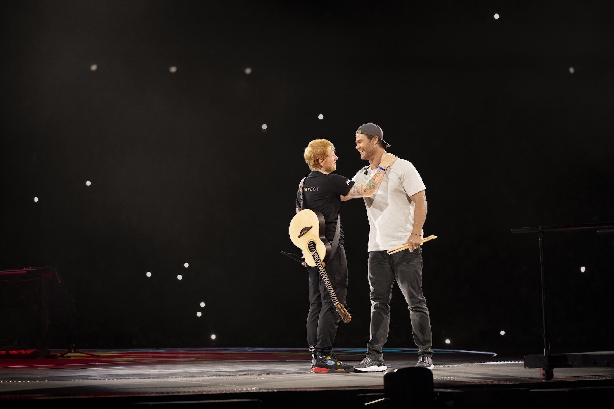 Global superstar Chris Hemsworth joins his friend, GRAMMY Award®-winning singer-songwriter Ed Sheeran, performing the song "Thinking Out Loud"in front of approximately 60,000 fans in Bucharest, Romania on August 24, 2024.(National Geographic/Evan Paterakis)