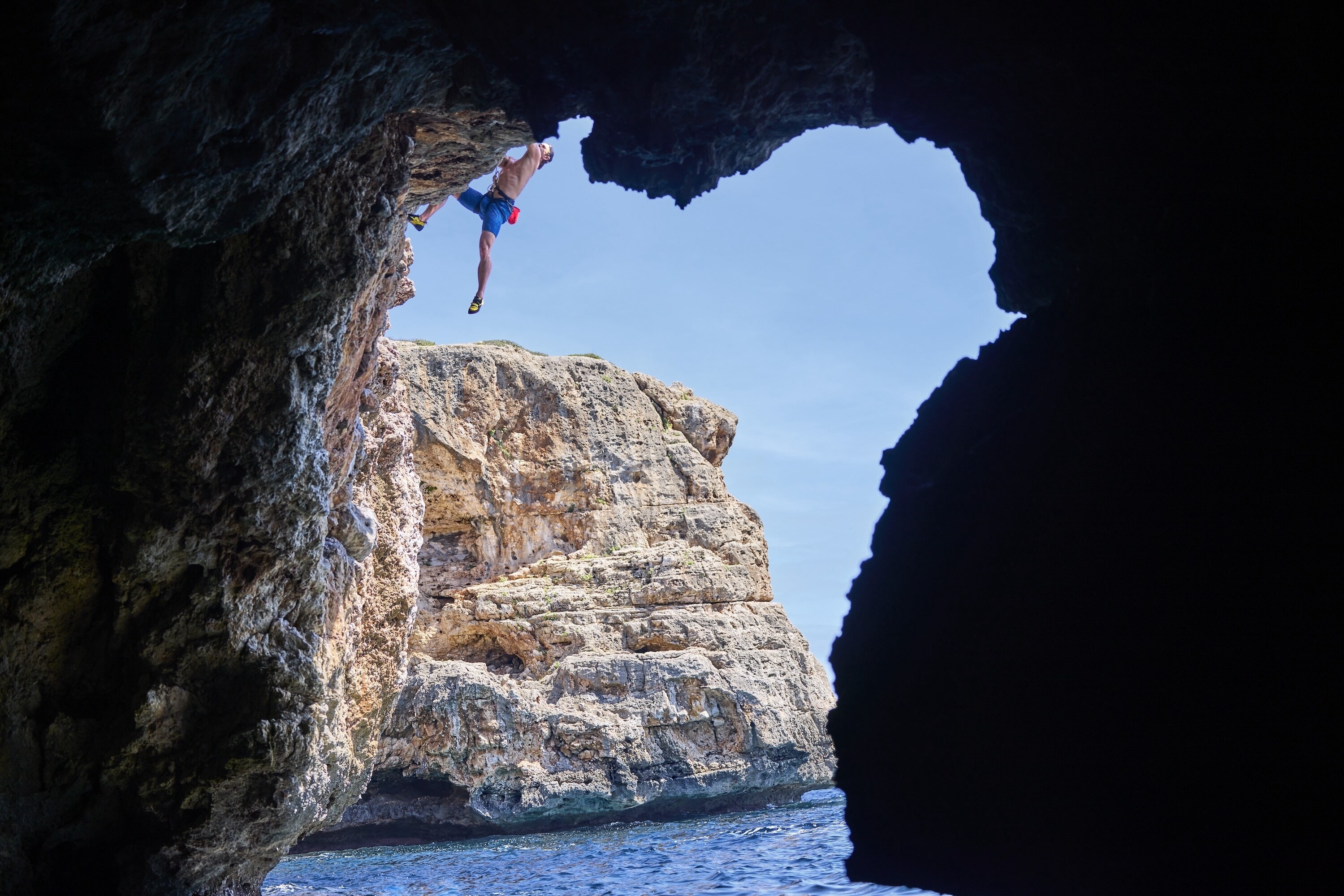 Chris recruits the help of Steph Davis, one of the best free solo climbers in the world, to train for a 'Deep Water Soloing' – no ropes, no safety equipment, just Chris climbing the rock face from the sea to the top of the cliff. This training will help prepare him for his final 600-foot climb on a wintery SwissAlps Dam. (credit: National Geographic/Evan Paterakis)