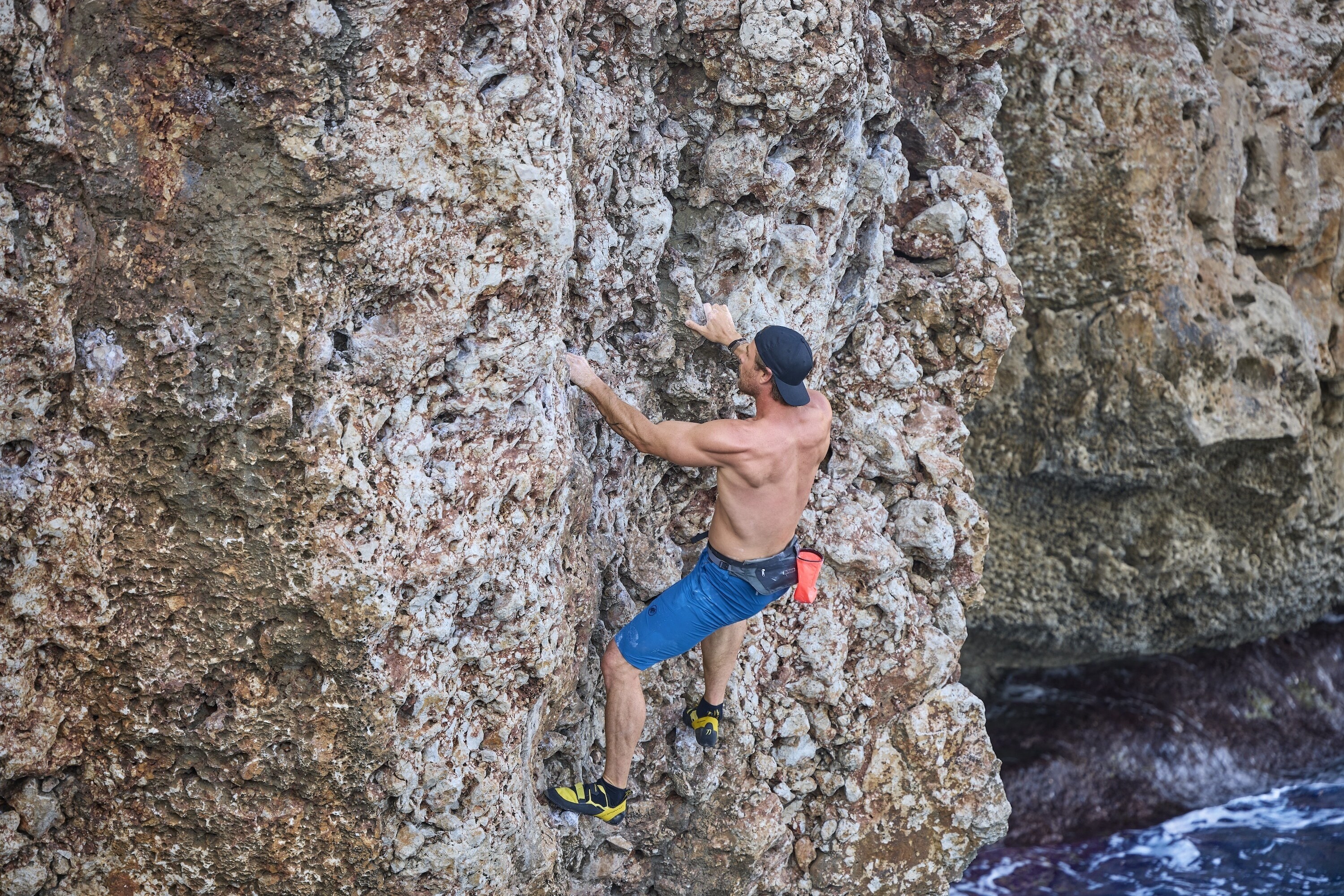 Chris recruits the help of Steph Davis, one of the best free solo climbers in the world, to train for a 'Deep Water Soloing' – no ropes, no safety equipment, just Chris climbing the rock face from the sea to the top of the cliff. This training will help prepare him for his final 600-foot climb on a wintery Swiss Alps Dam. (credit: National Geographic/Evan Paterakis)
