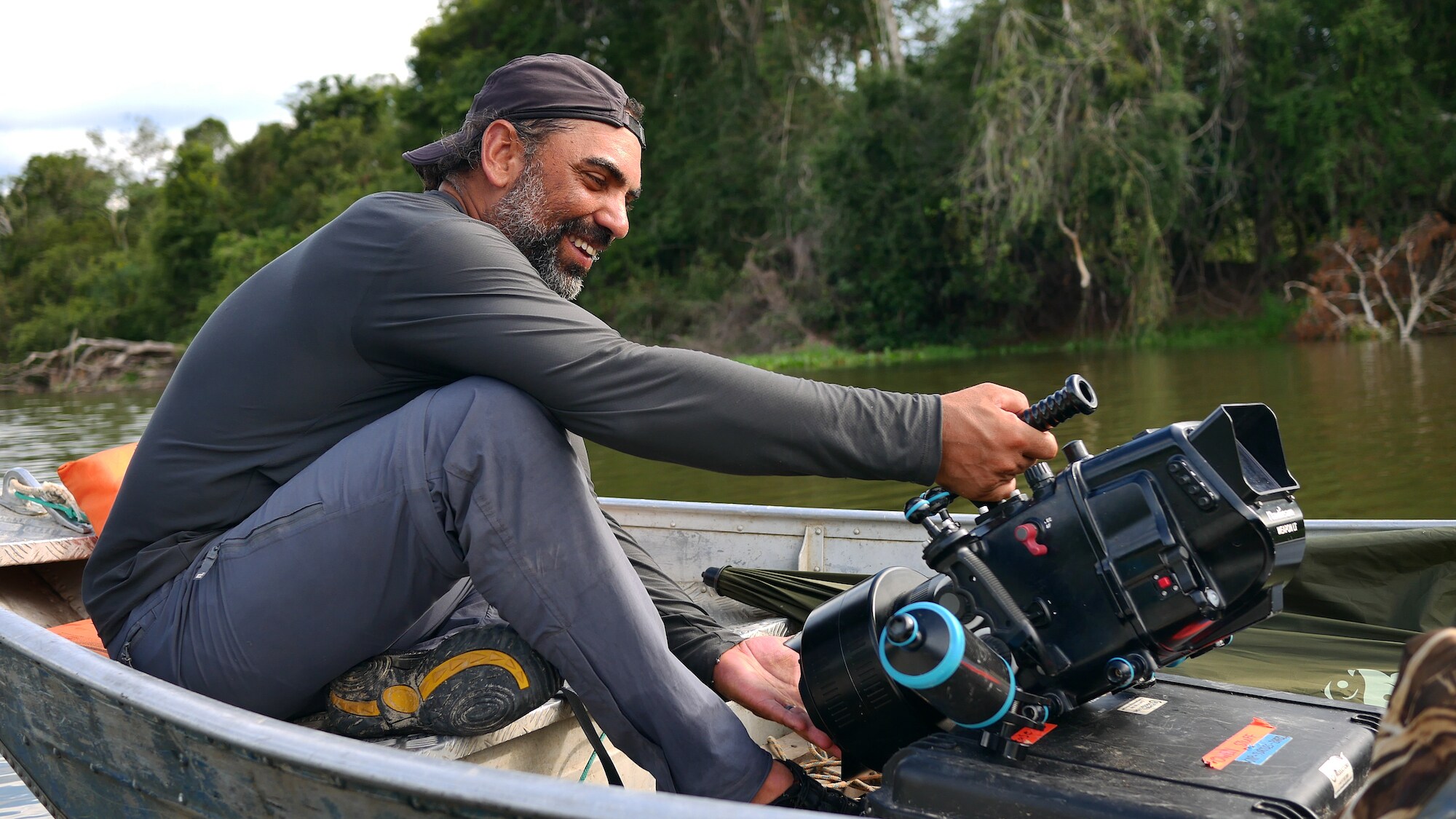 Cristian Dimitrius with a camera in underwater housing. (National Geographic for Disney+/Lillian Todd-Jones)