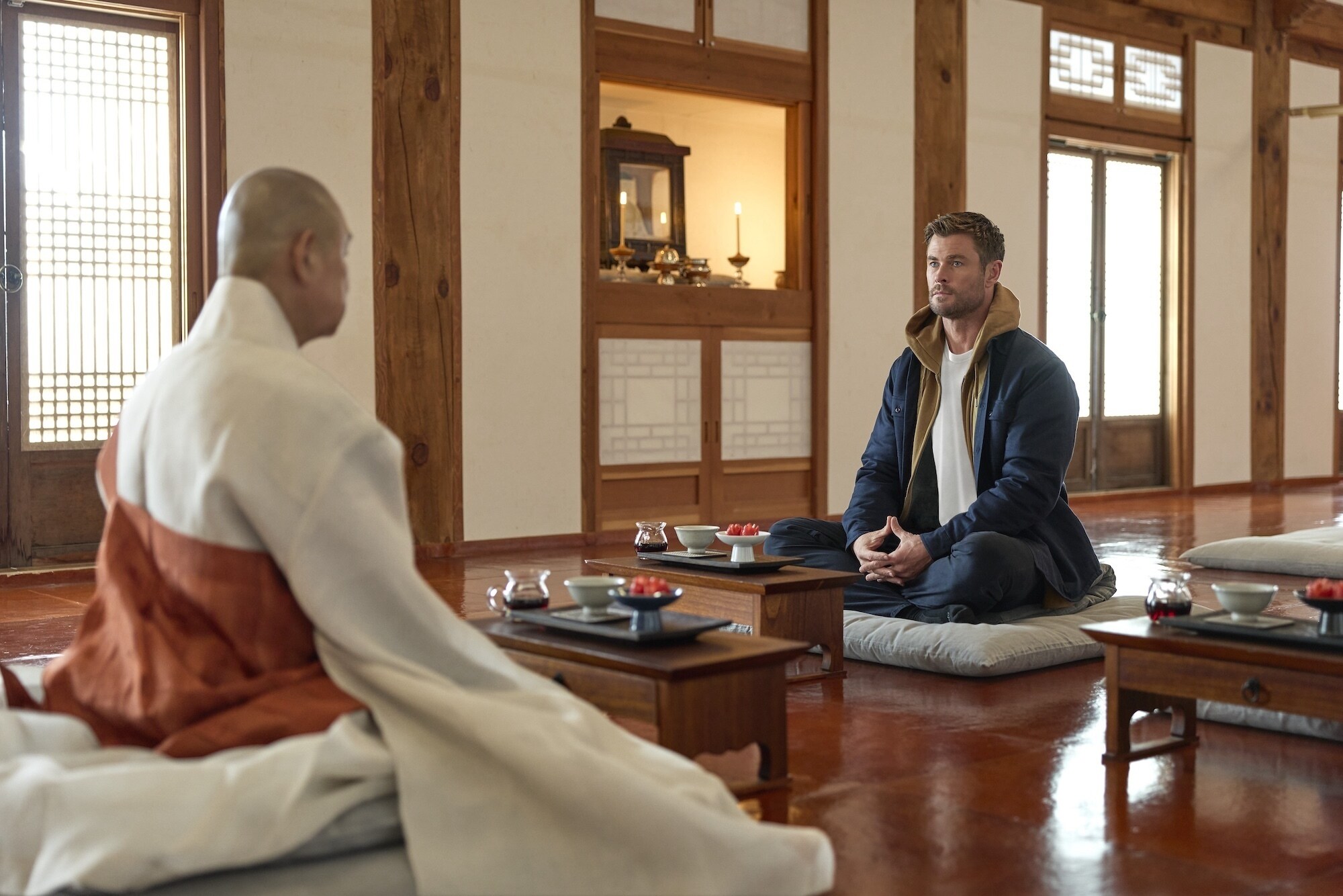 Chris Hemsworth sets out to confront his chronic pain in a bold, immersive journey through South Korea. Chris talks with Jeong Yeo, left, the Grand Patriarch of Beomeosa Temple in Busan, South Korea. (credit: National Geographic/EvanPaterakis)