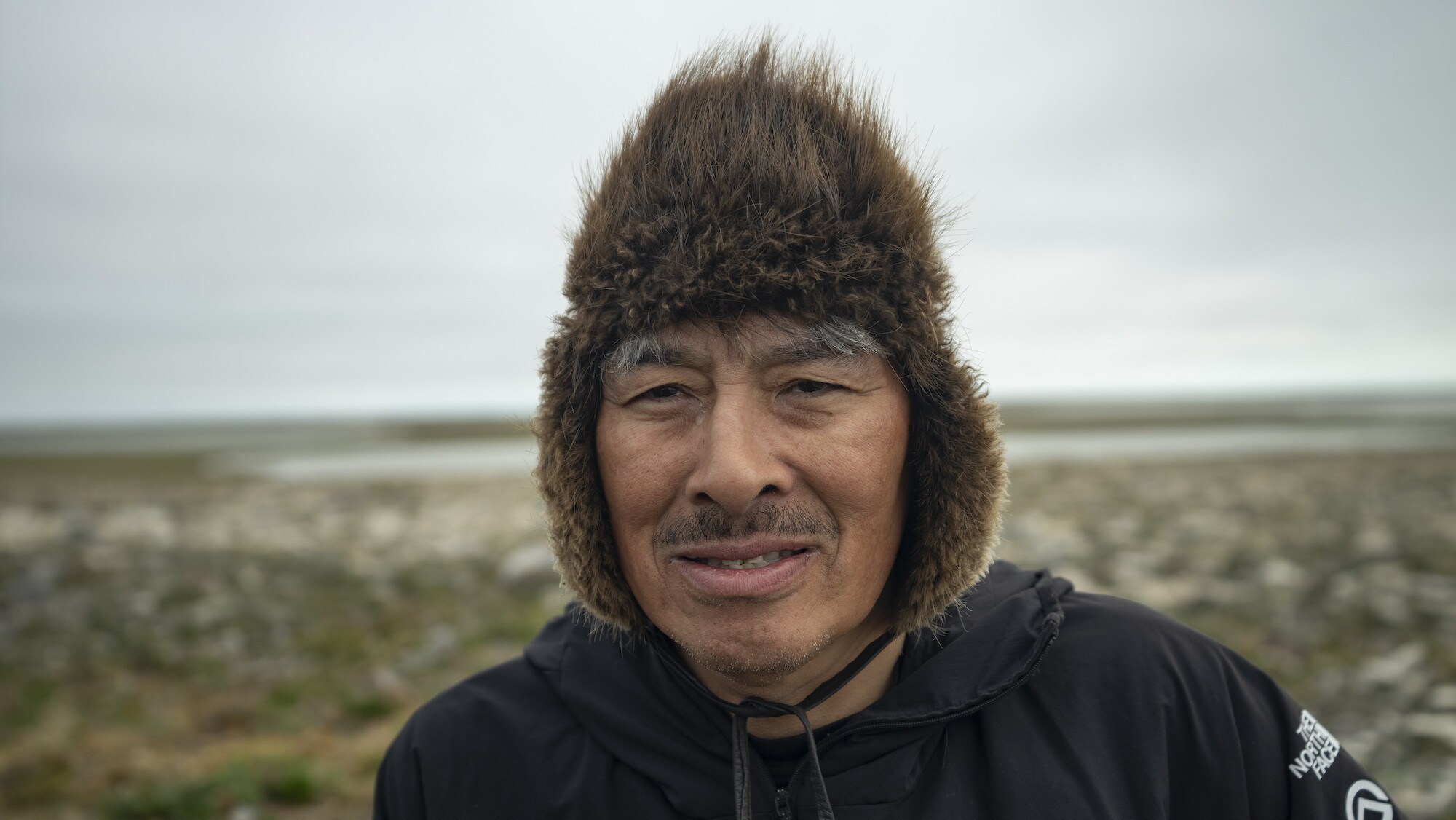 Team member Jacob Keanik poses for a portrait on King William Island, Nunavut, Canada. He is part of a team searching for Sir John Franklin's lost tomb on King William Island, Nunavut, Canada. (National Geographic/Renan Ozturk)