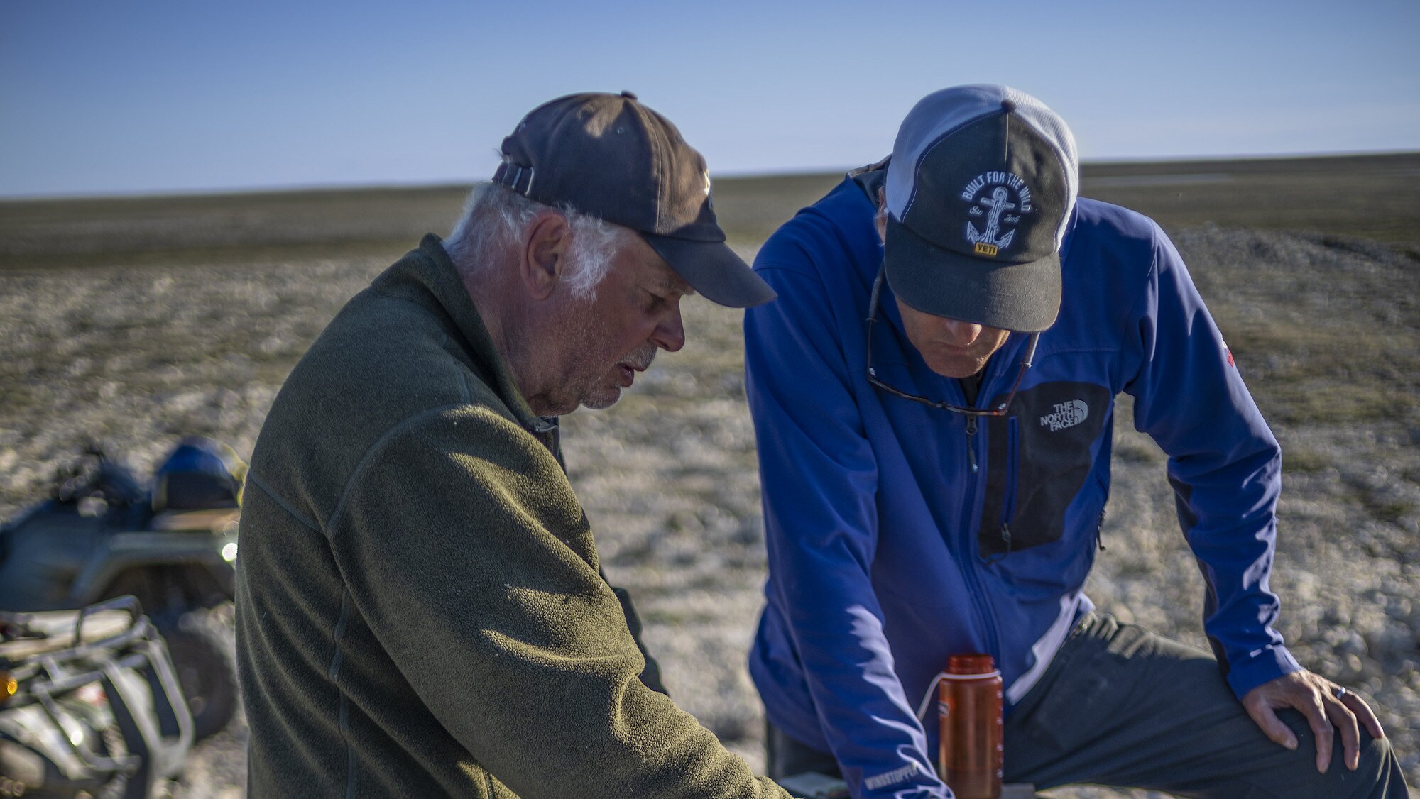 Explorer Mark Synnott and Franklin historian Tom Gross look over a map during their journey across King William Island to look for Sir John Franklin's lost tomb. (National Geographic/Renan Ozturk)
