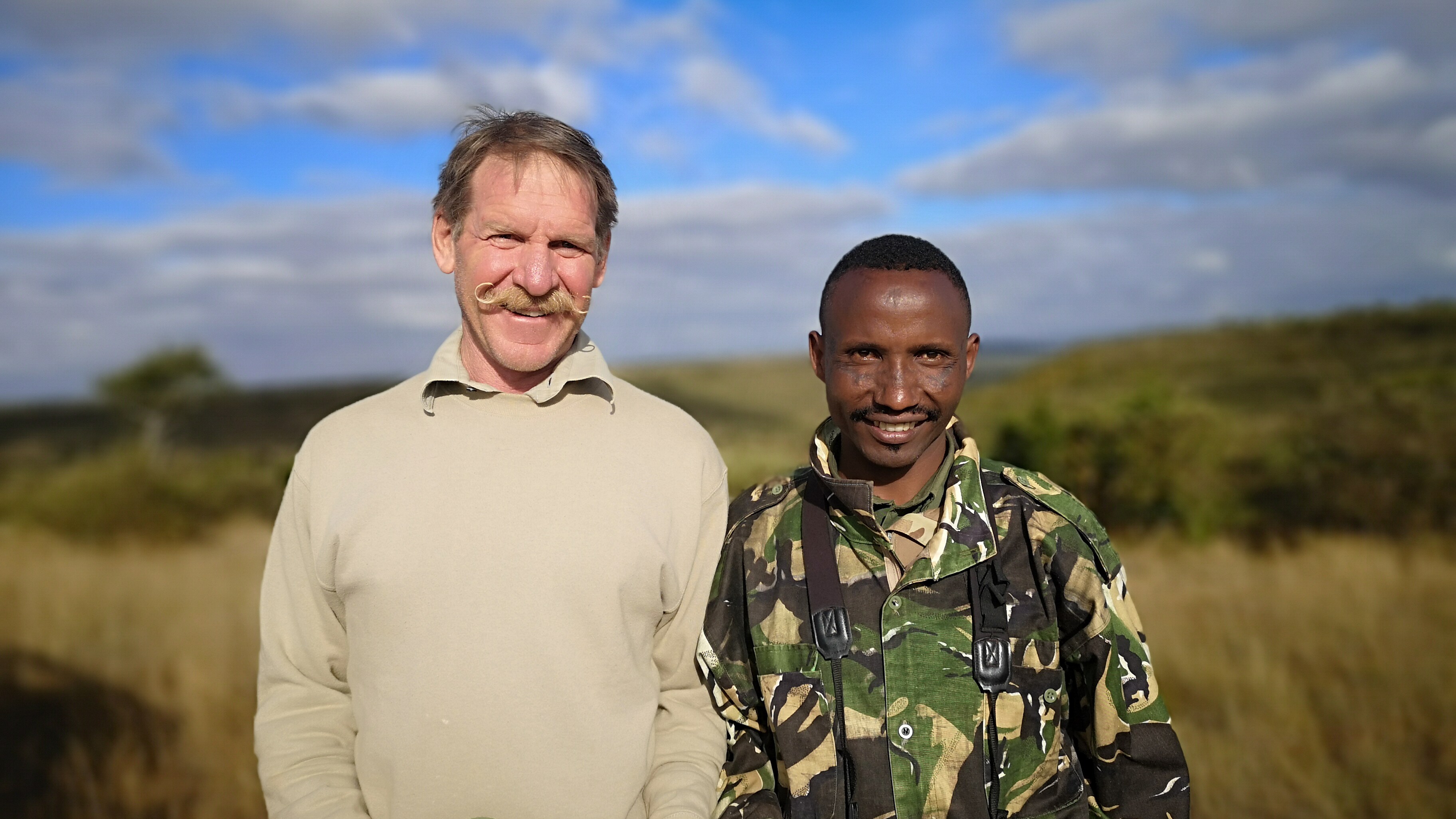 Guide, Peter Blackwell, left, and leopard researcher Lenguya Layon in Laikipia, Kenya.  (National Geographic for Disney+/Norbert Rottcheter)