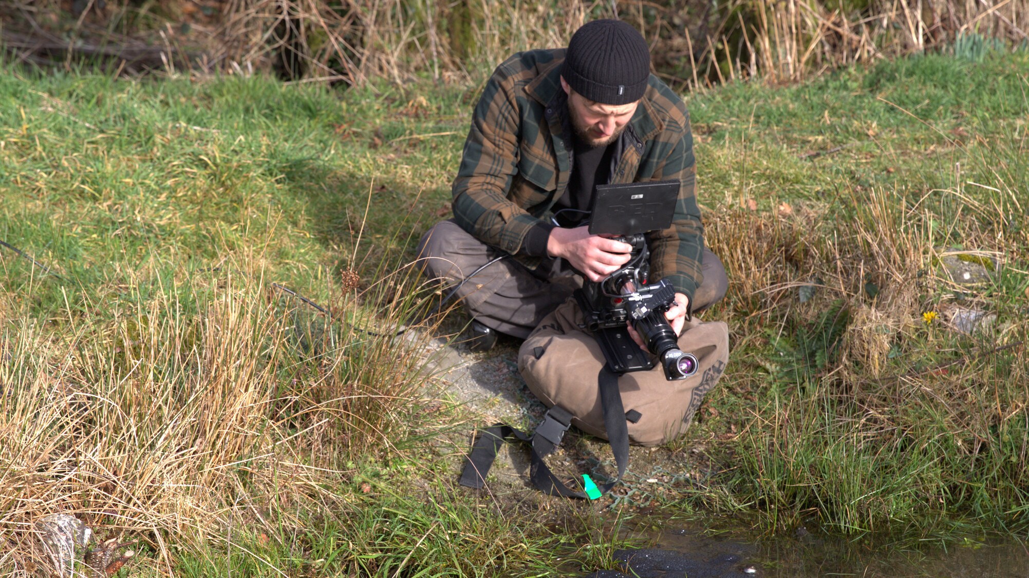 Director of Photography Chris Watts films common frogs gathering and spawning in a pond during a shoot for the "Once A Pond A Time" episode of "A Real Bug's Life." (National Geographic/Matt Haworth)