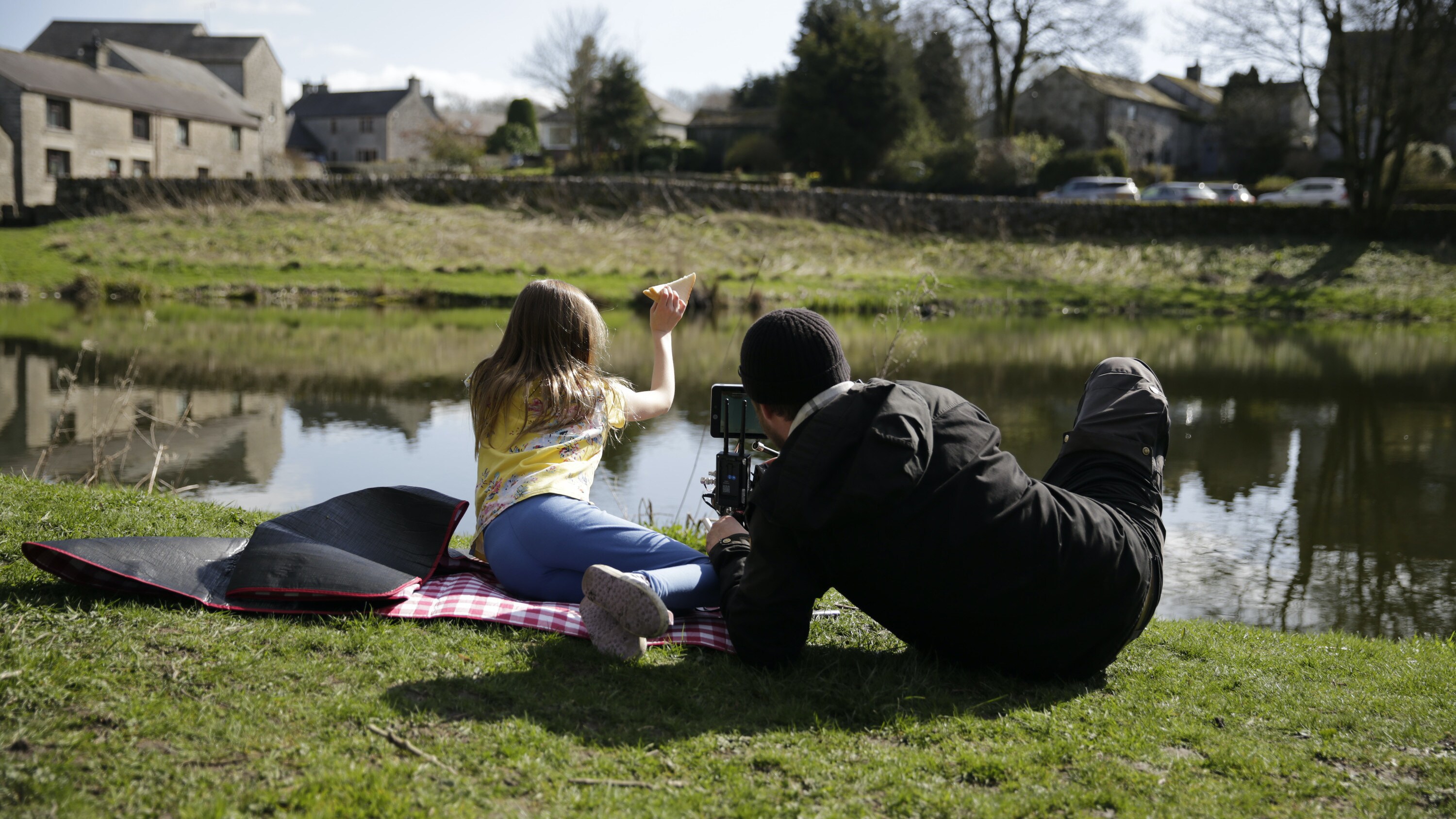 Director of Photography Chris Watts films young actor Menna throwing a sandwich into the pond for the "Once A Pond A Time" episode of "A Real Bug's Life." (National Geographic/Matt Haworth)