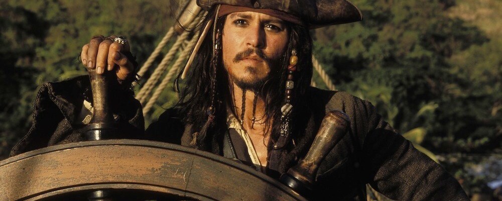 Actor Johnny Depp (Captain Jack Sparrow) steering a ship in "Pirates of the Caribbean"