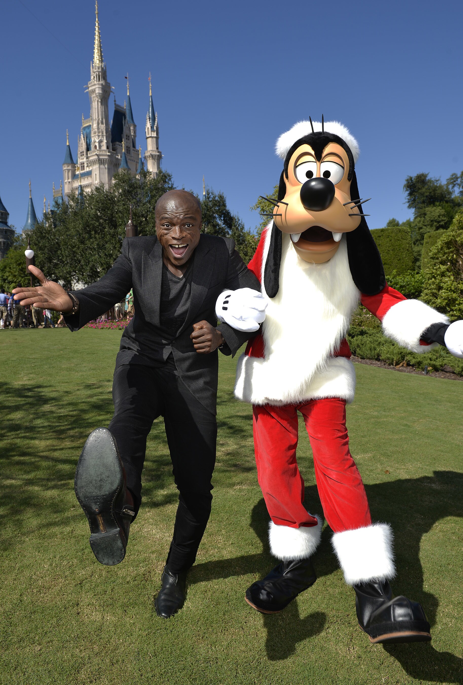 Seal poses Nov. 11, 2015 with Santa Goofy during a break from taping the 'Disney Parks Unforgetta...