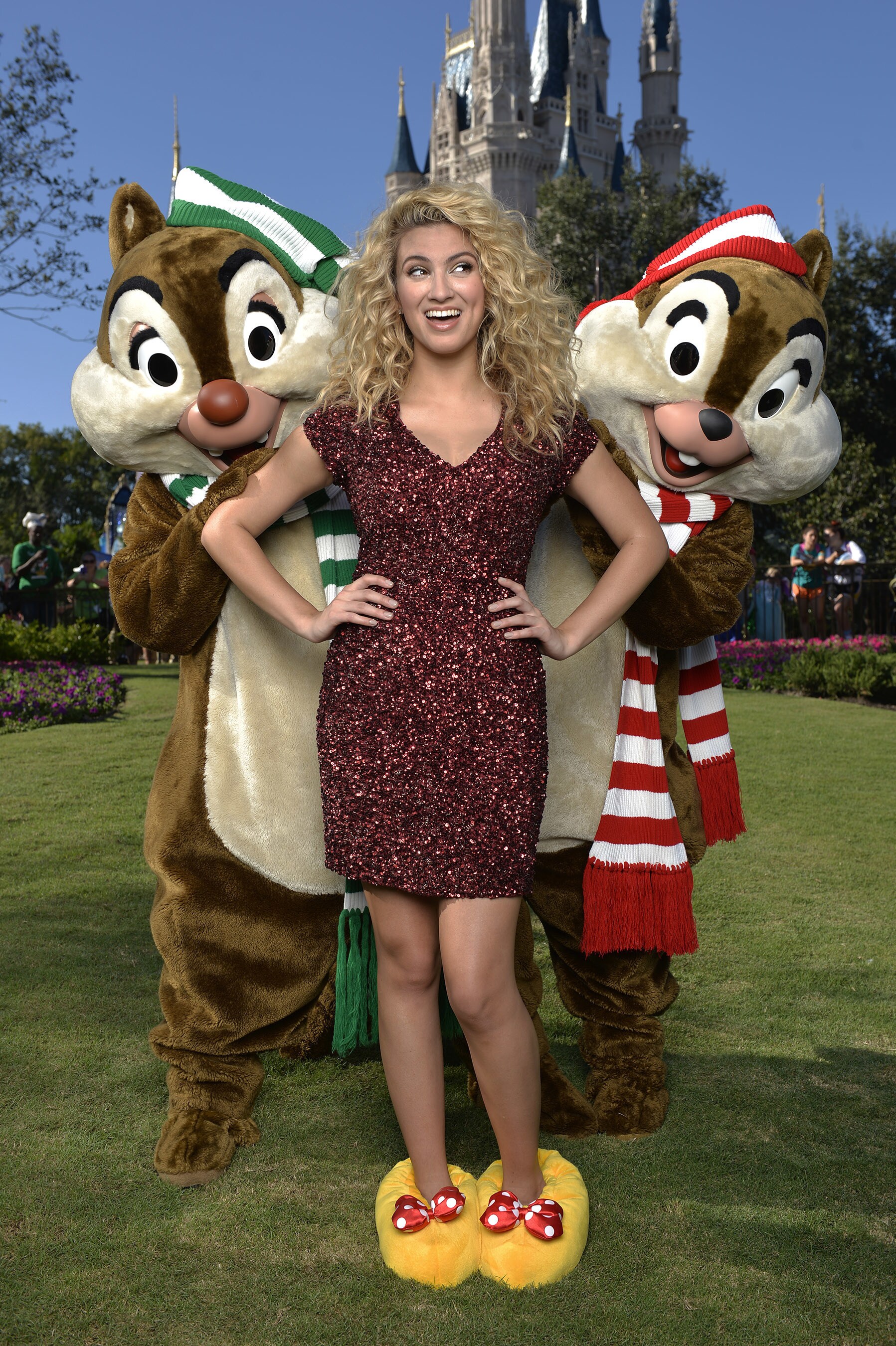 Tori Kelly poses Nov. 11, 2015 with Chip and Dale during a break from taping the 'Disney Parks Un...