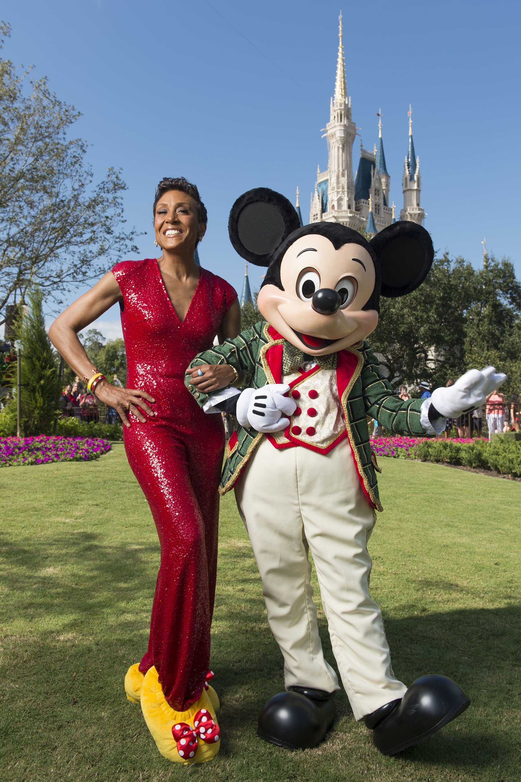 Robin Roberts poses Nov. 13, 2015 with Mickey Mouse during a break from taping the 'Disney Parks ...