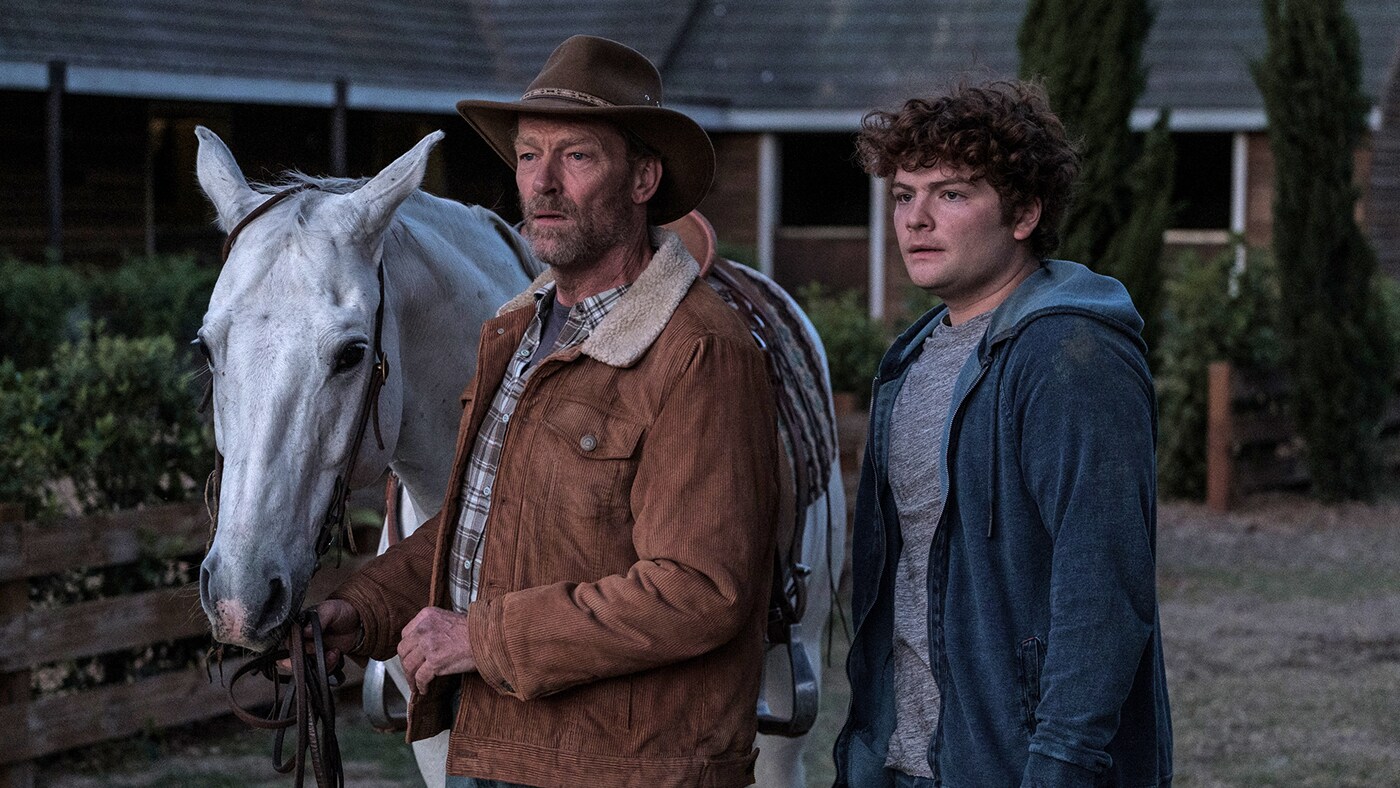 BLACK BEAUTY - A wild horse and a teenage girl forge an unbreakable bond which keeps them connected for a lifetime. (Disney/Graham Bartholomew) IAIN GLEN, MAX RAPHAEL