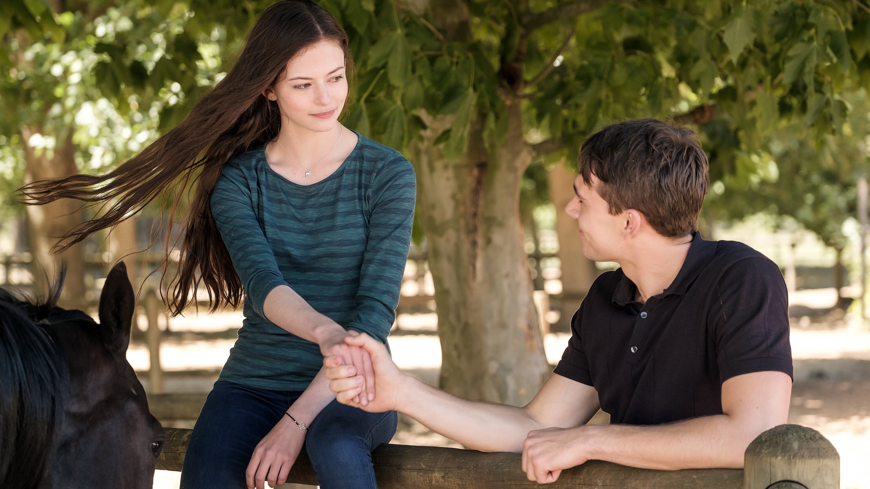 BLACK BEAUTY - A wild horse and a teenage girl forge an unbreakable bond which keeps them connected for a lifetime. (Disney/Graham Bartholomew) MACKENZIE FOY, CALAM LYNCH