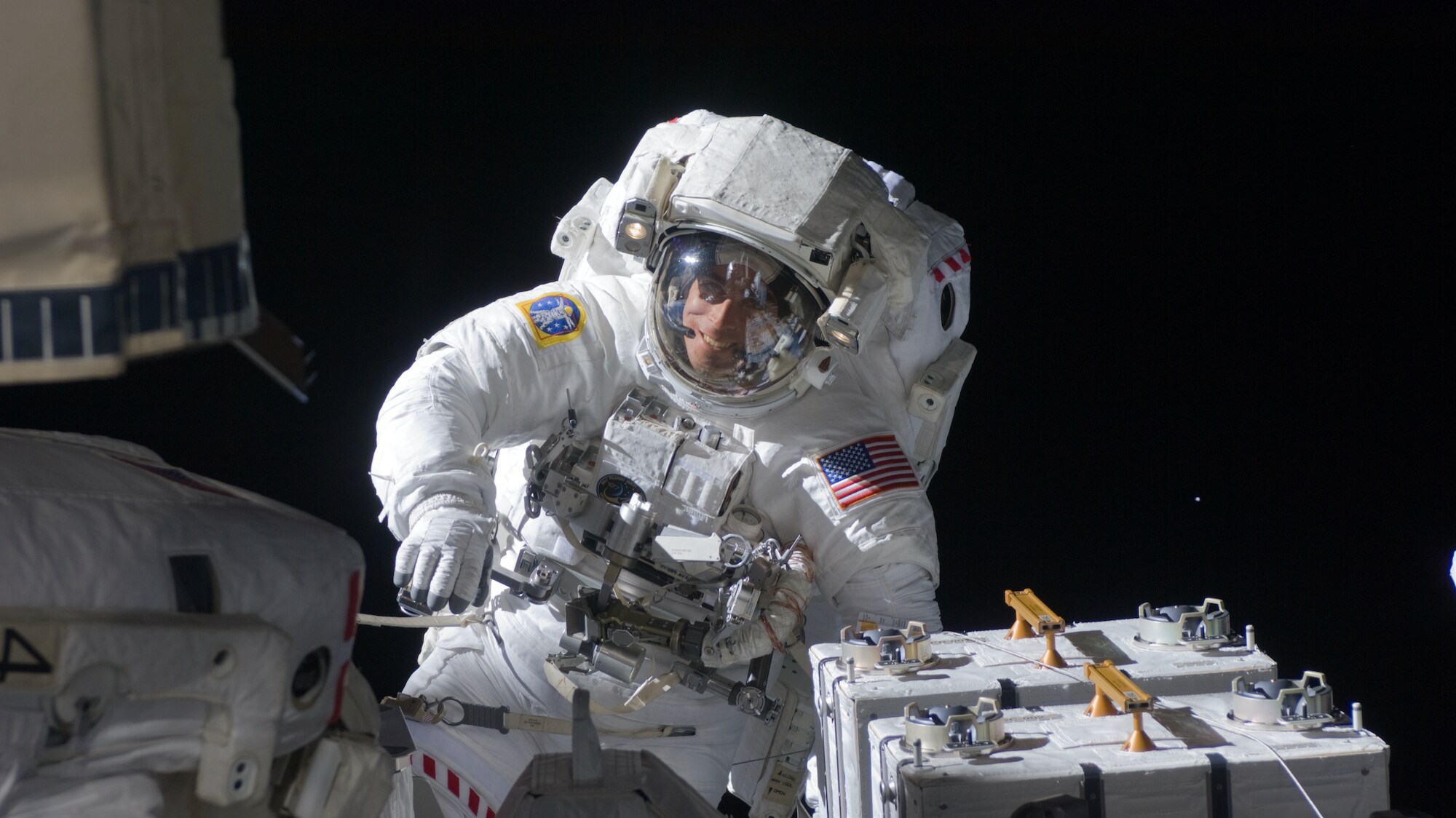 AMONG THE STARS - (27 July 2009) - Astronaut Christopher Cassidy, STS-127 mission specialist, participates in the mission's fifth and final session of extravehicular activity (EVA) as construction and maintenance continue on the International Space Station. During the four-hour, 54-minute spacewalk, Cassidy and astronaut Tom Marshburn (out of frame), mission specialist, secured multi-layer insulation around the Special Purpose Dexterous Manipulator known as Dextre, split out power channels for two space station Control Moment Gyroscopes, installed video cameras on the front and back of the new Japanese Exposed Facility and performed a number of “get ahead” tasks, including tying down some cables and installing handrails and a portable foot restraint to aid future spacewalkers. (NASA)  CHRIS CASSIDY