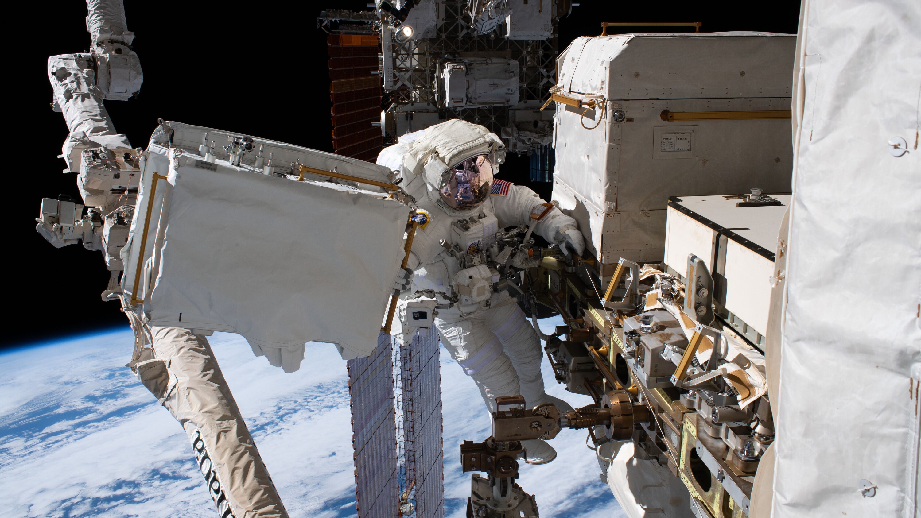 AMONG THE STARS - (Dec. 2, 2019) - NASA astronaut Andrew Morgan is tethered to the International Space Station with the Earth 250 miles below during the third spacewalk to upgrade the Alpha Magnetic Spectrometer's thermal pump system. (NASA) ANDREW MORGAN