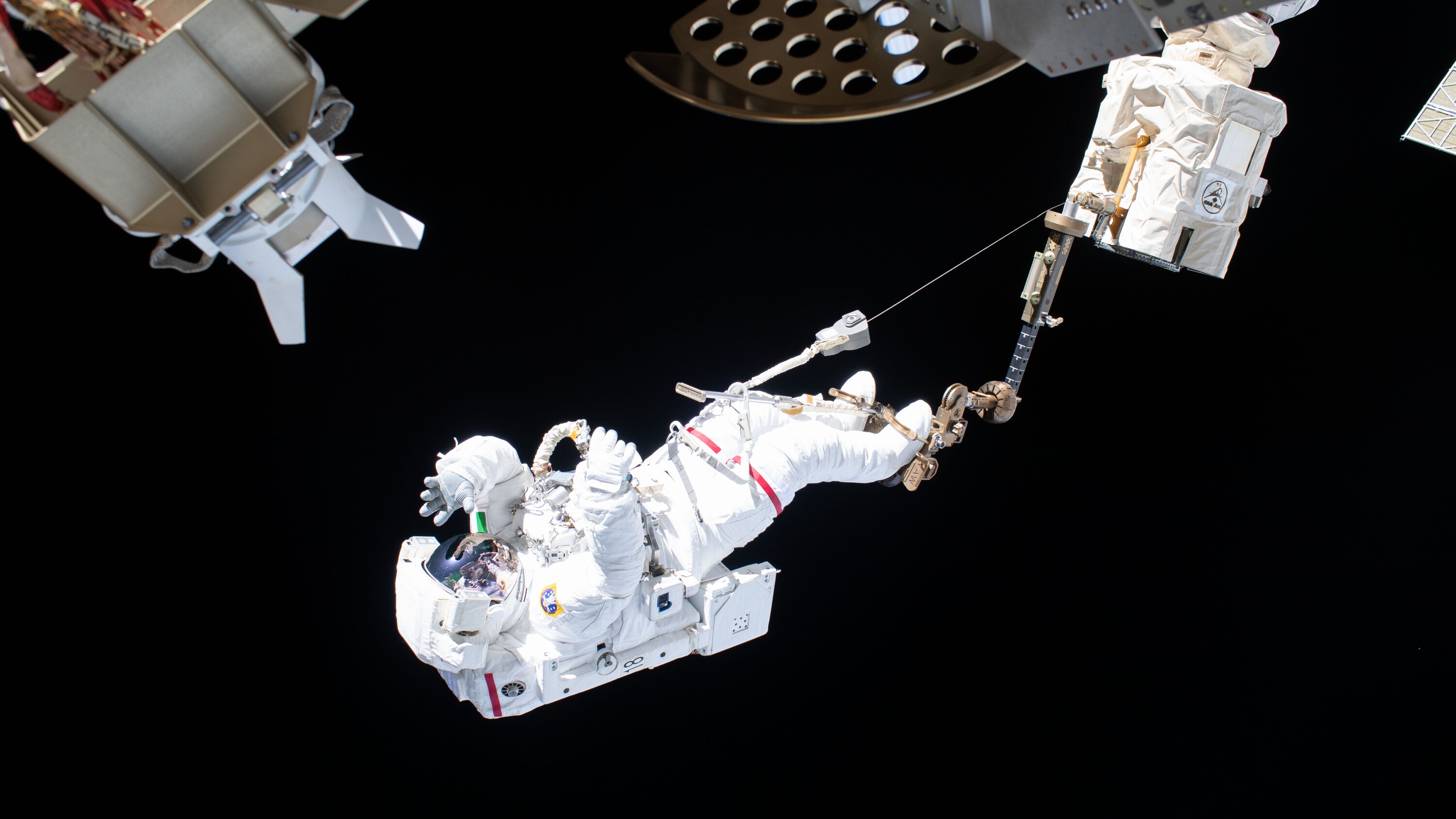 AMONG THE STARS - (Nov. 22, 2019) --- Astronaut Luca Parmitano of ESA (European Space Agency) is attached to an articulating portable foot restraint at the end of the Canadarm2 robotic arm during the second spacewalk to repair the International Space Station's cosmic particle detector, the Alpha Magnetic Spectrometer. (NASA) LUCA PARMITANO