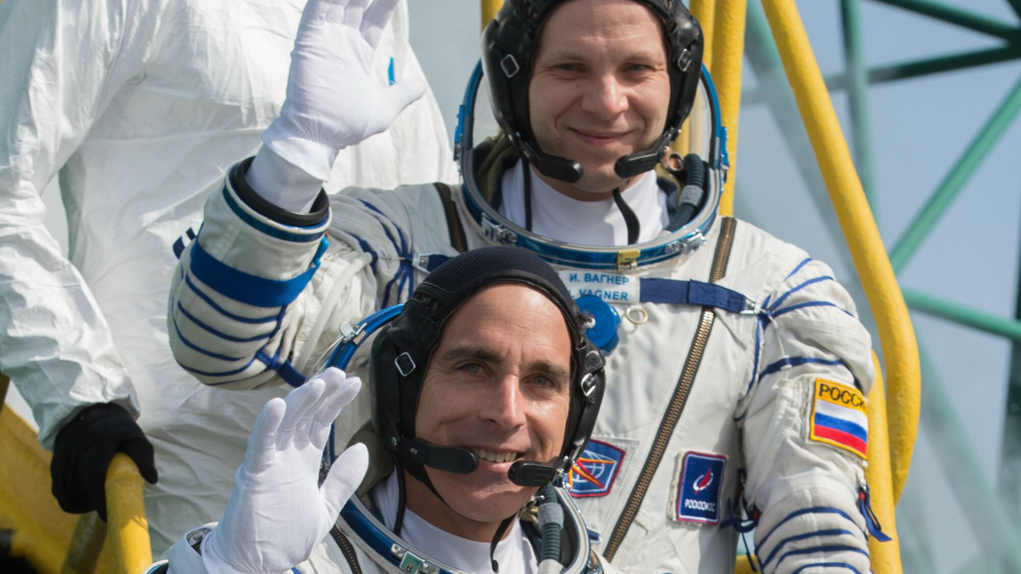 AMONG THE STARS - Expedition 63 crewmembers Ivan Vagner of Roscosmos, top, Chris Cassidy of NASA, center, and Anatoly Ivanishin wave goodbye as they prepare to climb aboard the Soyuz MS-16 rocket at Site 31 at the Baikonur Cosmodrome in Kazakhstan, Thursday, April 9, 2020. They launched a short time later to the International Space Station for the start of a six-and-a-half month mission. (NASA/GCTC/Andrey Shelepin) IVAN VAGNER, CHRIS CASSIDY, ANATOLY IVANISHIN