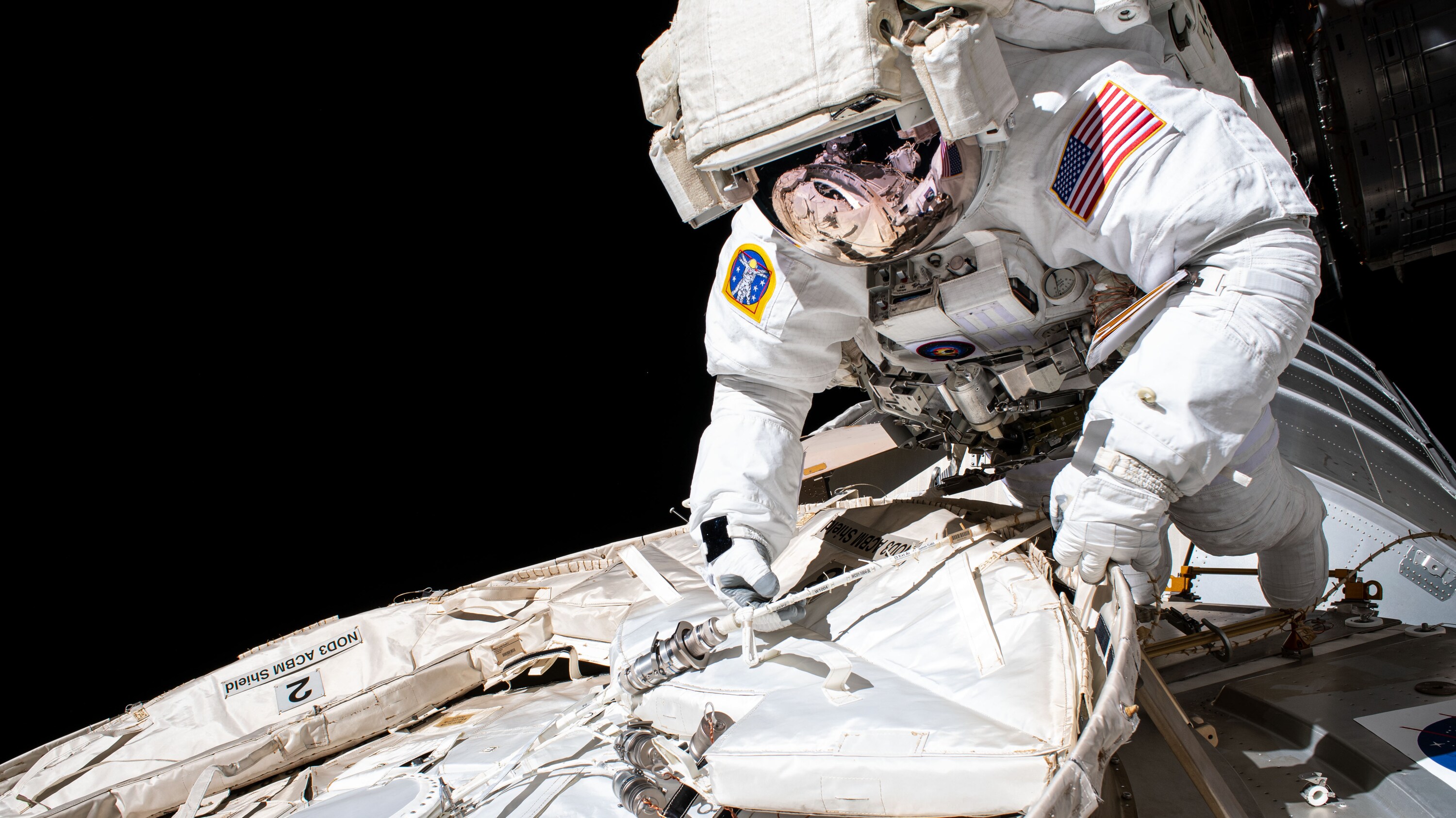 AMONG THE STARS - (July 21, 2020) - NASA astronaut and Expedition 63 Commander Chris Cassidy conducts a spacewalk to set up the Tranquility module for the future installation of a NanoRacks airlock that will enable public and commercial research on the outside of the International Space Station. Cassidy has completed 10 spacewalks throughout his career for a total of 54 hours and 51 minutes spacewalking time. (NASA) CHRIS CASSIDY