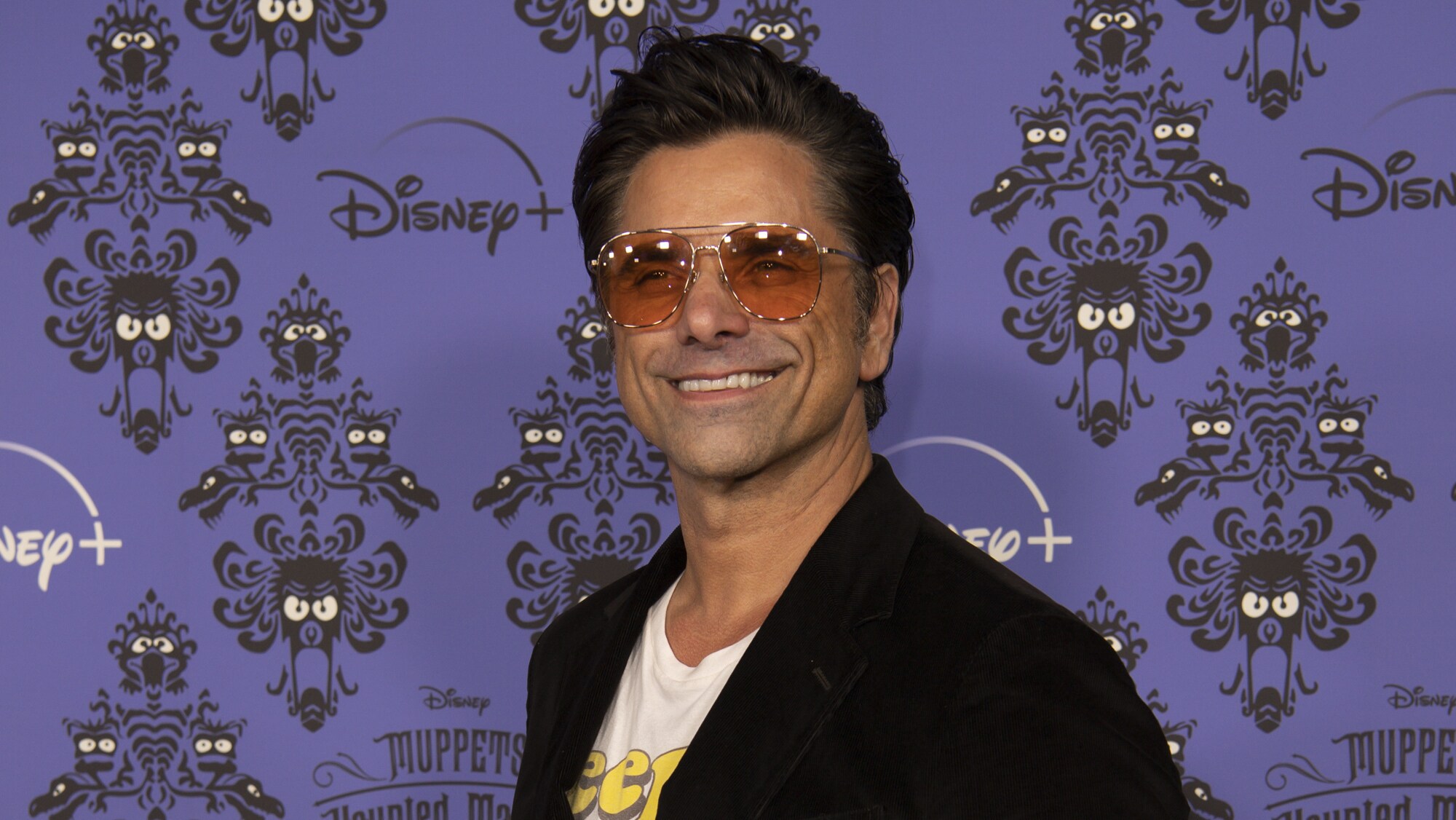 MUPPETS HAUNTED MANSION - Stars of The Muppets first-ever Halloween special "Muppets Haunted Mansion" attended the Drive-In Premiere Event at West Los Angeles College, Thursday, October 7. "Muppets Haunted Mansion" is available to stream Friday, October 8 on Disney+. (Disney/Richard Harbaugh) JOHN STAMOS