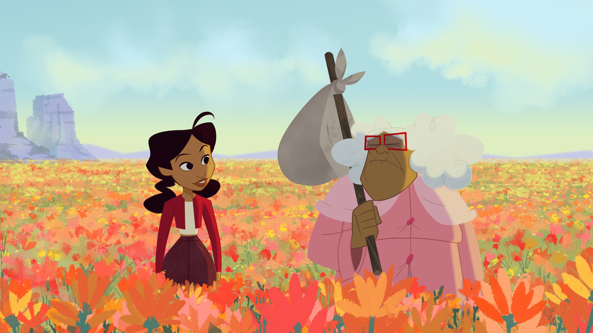 Penny Proud and Suga Mamma stand in a field of flowers