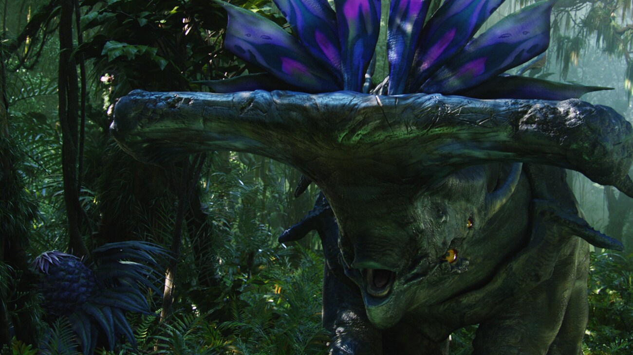 A Hammerhead Titanothere puts on a threat display in the forest.