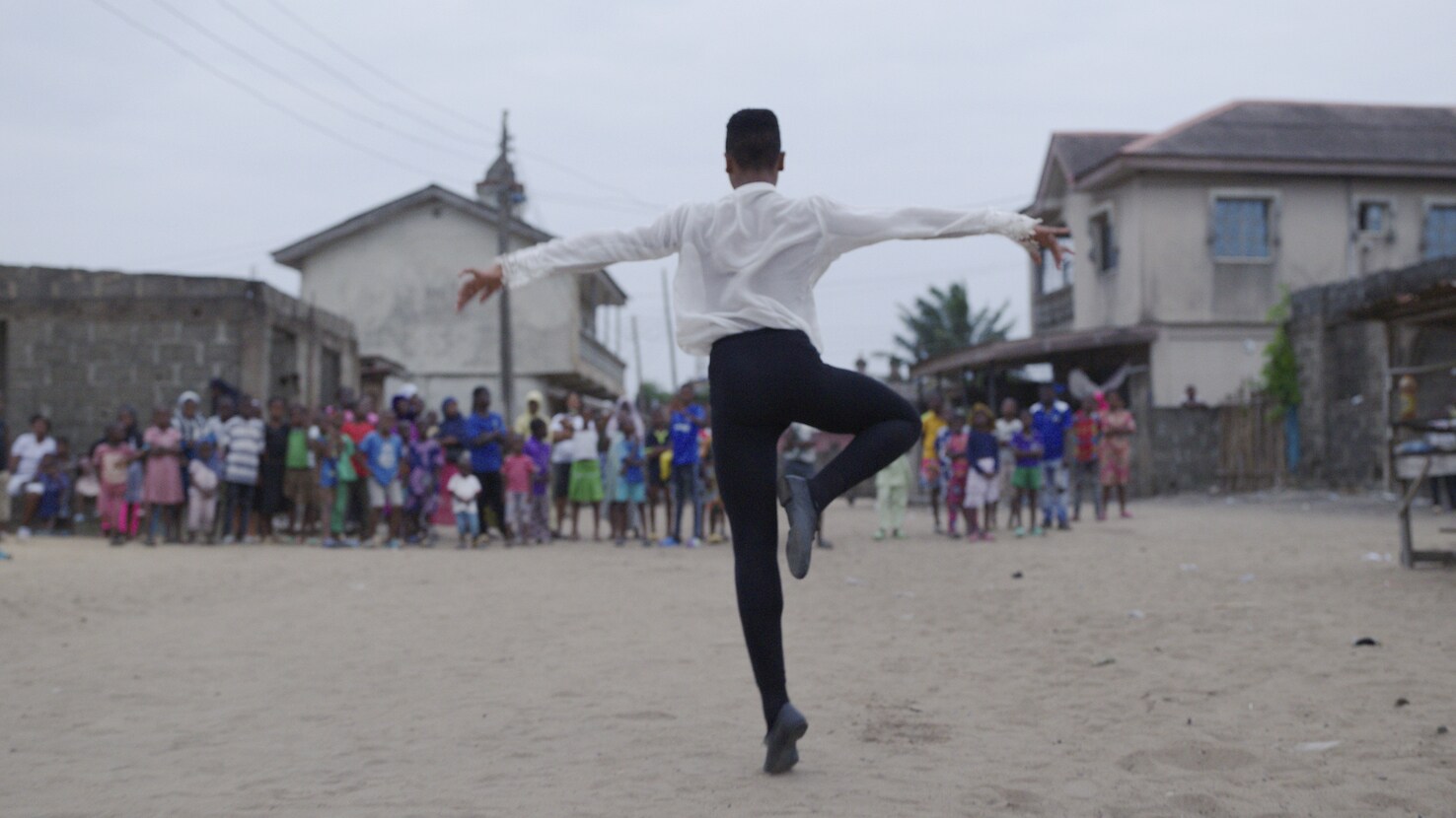 MADU - Anthony Madu dances in front of an audience during his summer break trip back to his home in the Ajangbadi suburb of Lagos, Nigeria. (Disney)