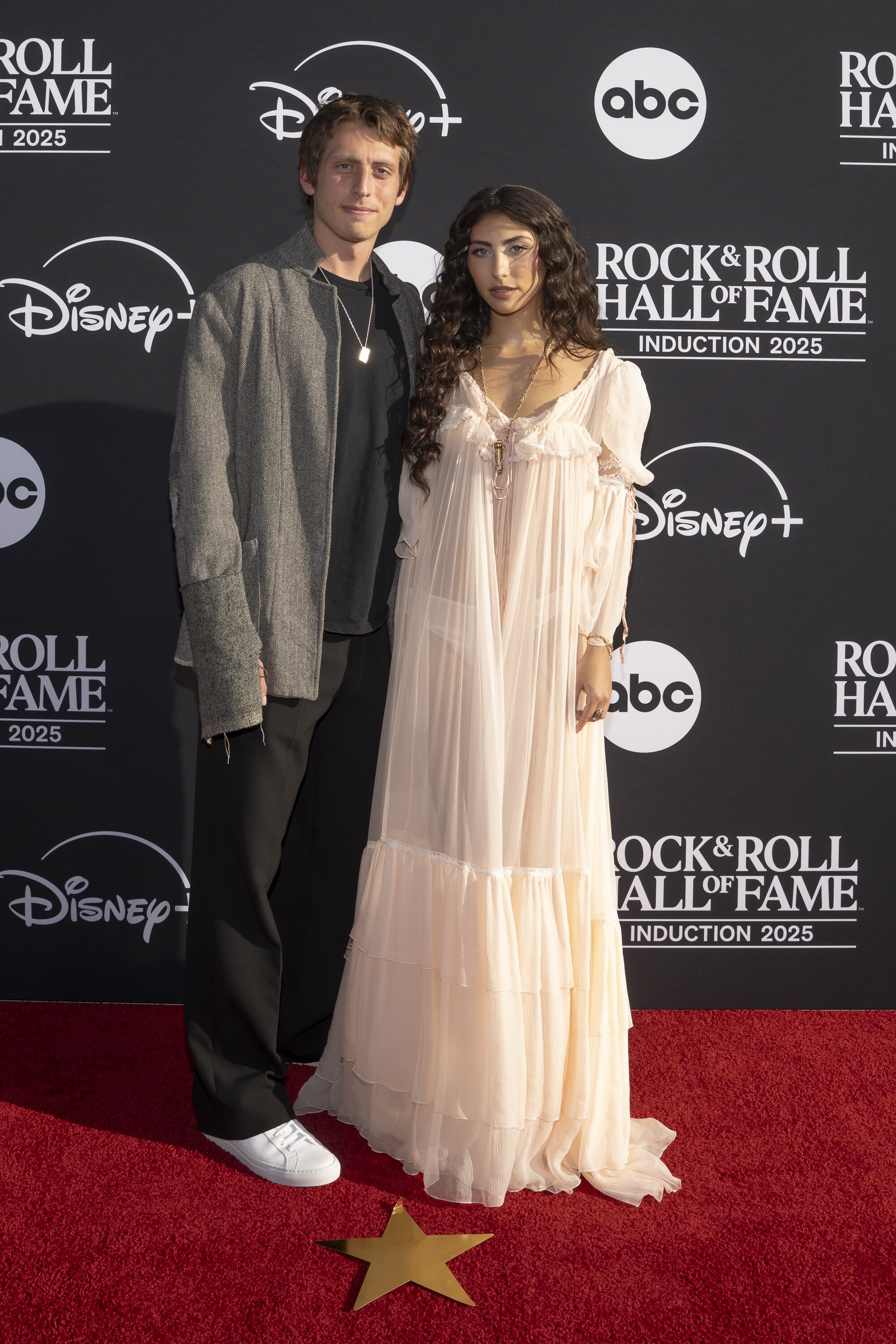 ROCK & ROLL HALL OF FAME 2025 INDUCTION CEREMONY – The 2025 Rock & Roll Hall of Fame Induction Ceremony, with once-in-a-lifetime performances and collaborations paying tribute to the iconic, generation-defining inductees, will be broadcast live coast to coast from Los Angeles on SATURDAY, NOV. 8 (8:00 p.m. EDT) on Disney+. (Disney/Cristian Lopez)  CHRIS CORNELL JR., VICKY CORNELL, TONI CORNELL 