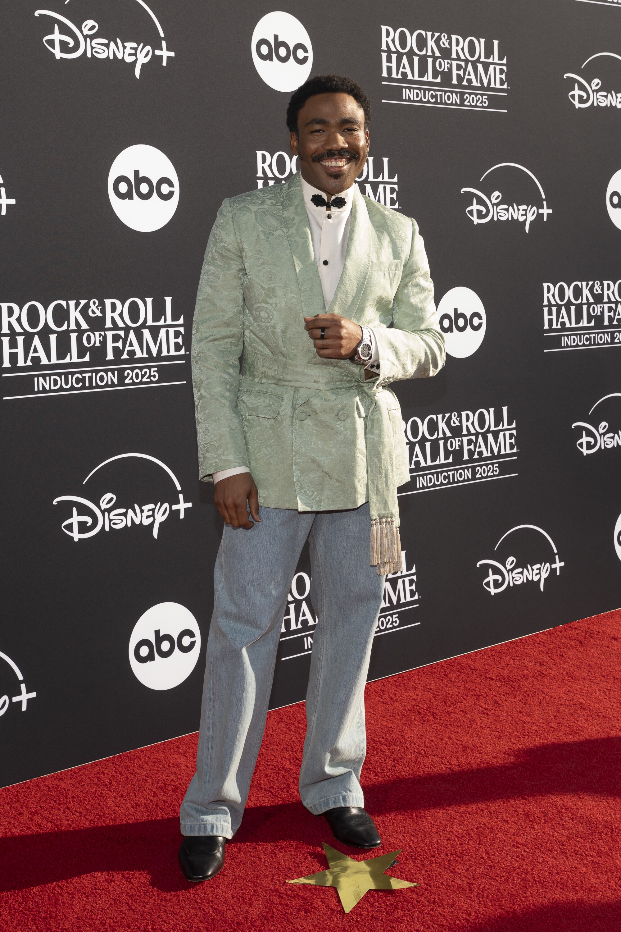 ROCK & ROLL HALL OF FAME 2025 INDUCTION CEREMONY – The 2025 Rock & Roll Hall of Fame Induction Ceremony, with once-in-a-lifetime performances and collaborations paying tribute to the iconic, generation-defining inductees, will be broadcast live coast to coast from Los Angeles on SATURDAY, NOV. 8 (8:00 p.m. EDT) on Disney+. (Disney/Cristian Lopez)  DONALD GLOVER 