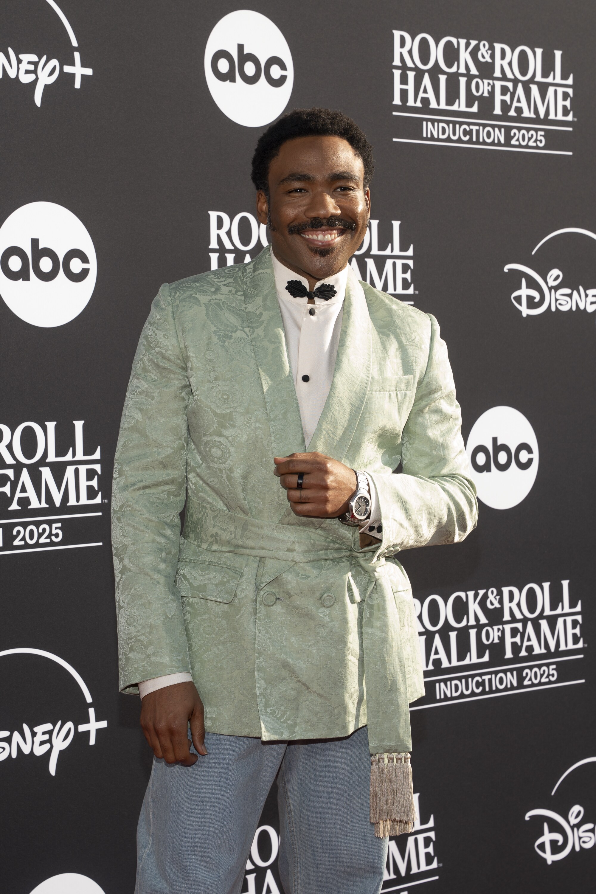 ROCK & ROLL HALL OF FAME 2025 INDUCTION CEREMONY – The 2025 Rock & Roll Hall of Fame Induction Ceremony, with once-in-a-lifetime performances and collaborations paying tribute to the iconic, generation-defining inductees, will be broadcast live coast to coast from Los Angeles on SATURDAY, NOV. 8 (8:00 p.m. EDT) on Disney+. (Disney/Cristian Lopez)  DONALD GLOVER 