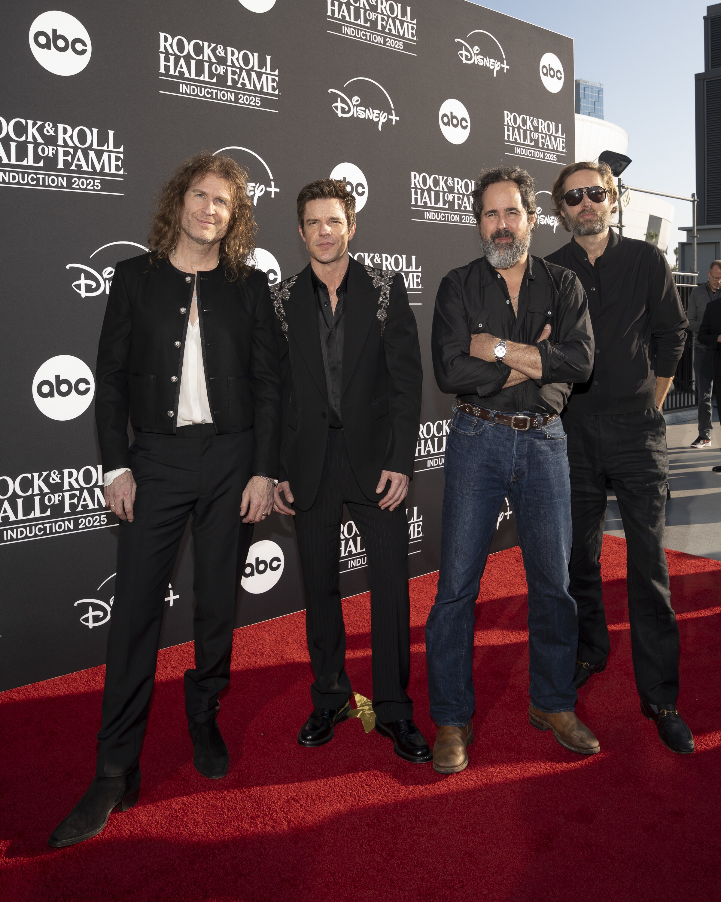 ROCK & ROLL HALL OF FAME 2025 INDUCTION CEREMONY – The 2025 Rock & Roll Hall of Fame Induction Ceremony, with once-in-a-lifetime performances and collaborations paying tribute to the iconic, generation-defining inductees, will be broadcast live coast to coast from Los Angeles on SATURDAY, NOV. 8 (8:00 p.m. EDT) on Disney+. (Disney/Cristian Lopez)  DAVE KEUNING, BRANDON FLOWERS, RONNIE VANNUCCI JR., MARK STOERMER  