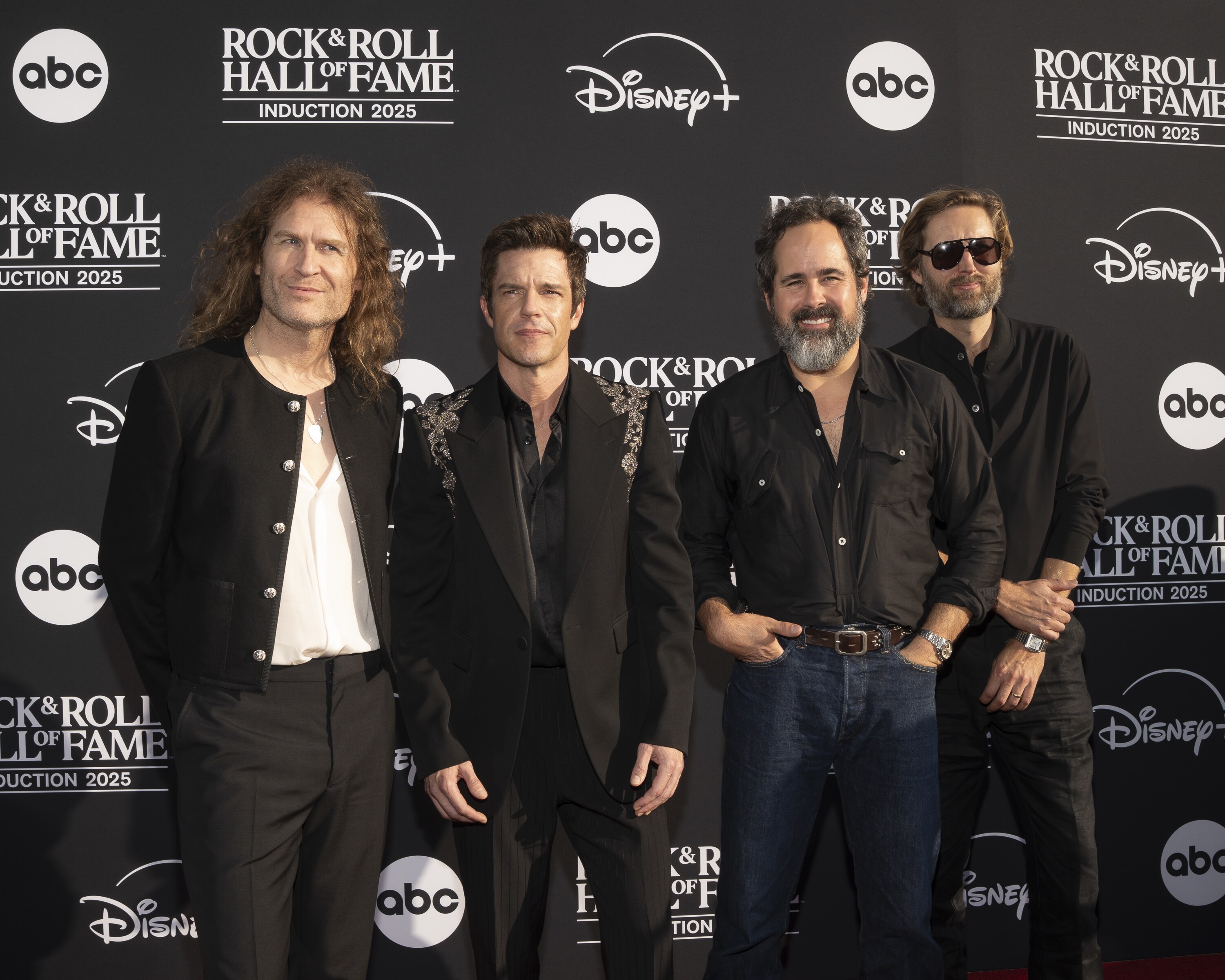 ROCK & ROLL HALL OF FAME 2025 INDUCTION CEREMONY – The 2025 Rock & Roll Hall of Fame Induction Ceremony, with once-in-a-lifetime performances and collaborations paying tribute to the iconic, generation-defining inductees, will be broadcast live coast to coast from Los Angeles on SATURDAY, NOV. 8 (8:00 p.m. EDT) on Disney+. (Disney/Cristian Lopez)  DAVE KEUNING, BRANDON FLOWERS, RONNIE VANNUCCI JR., MARK STOERMER 