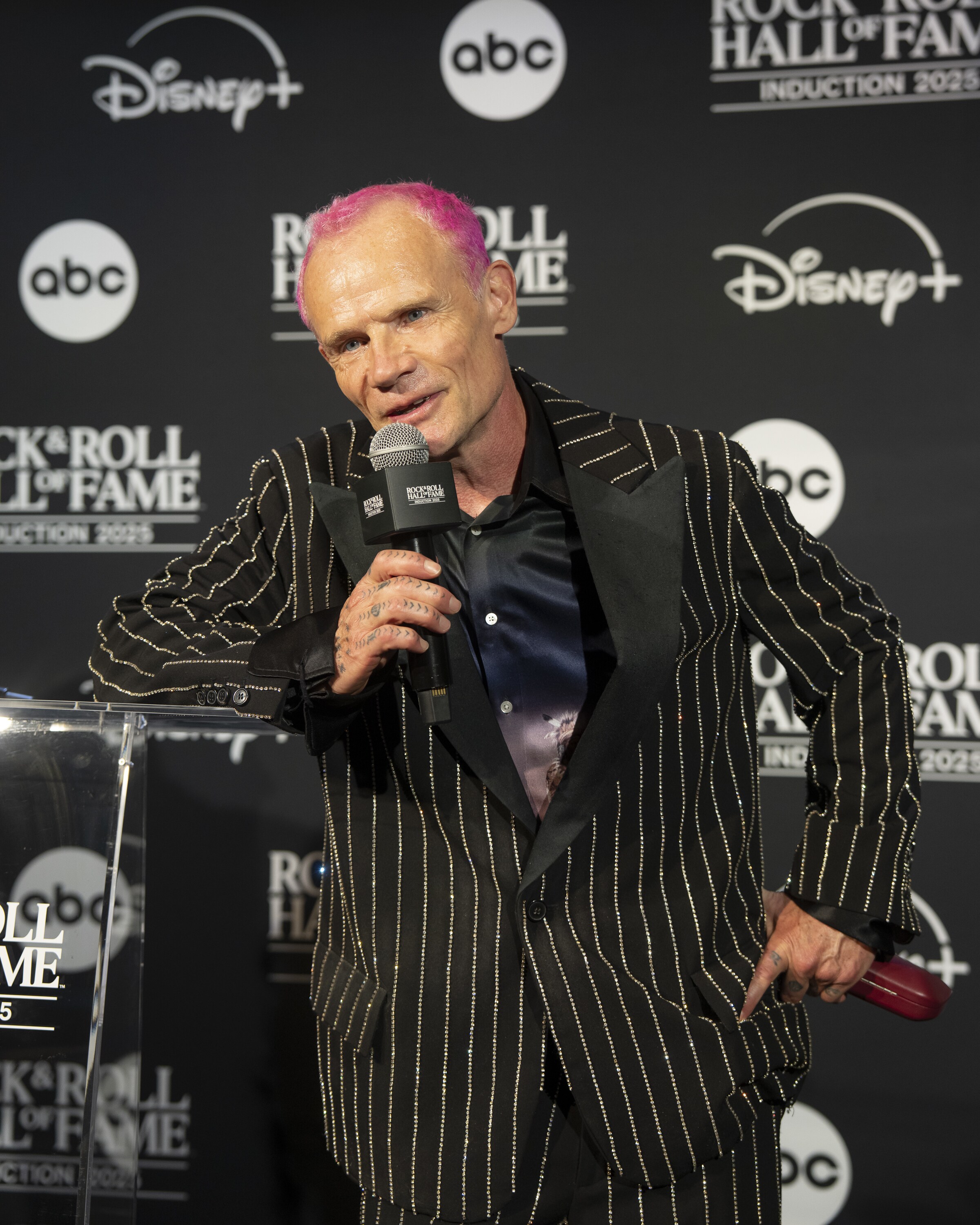 ROCK & ROLL HALL OF FAME 2025 INDUCTION CEREMONY – The 2025 Rock & Roll Hall of Fame Induction Ceremony, with once-in-a-lifetime performances and collaborations paying tribute to the iconic, generation-defining inductees, will be broadcast live coast to coast from Los Angeles on SATURDAY, NOV. 8 (8:00 p.m. EDT) on Disney+. (Disney/Ser Baffo)  FLEA 