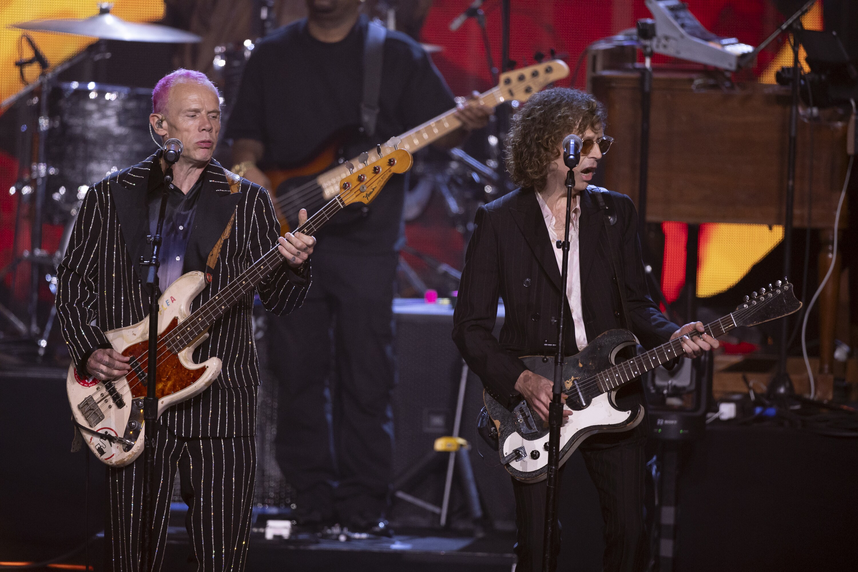 ROCK & ROLL HALL OF FAME 2025 INDUCTION CEREMONY – The 2025 Rock & Roll Hall of Fame Induction Ceremony, with once-in-a-lifetime performances and collaborations paying tribute to the iconic, generation-defining inductees, will be broadcast live coast to coast from Los Angeles on SATURDAY, NOV. 8 (8:00 p.m. EDT) on Disney+. (Disney/Frank Micelotta)  FLEA, BECK 