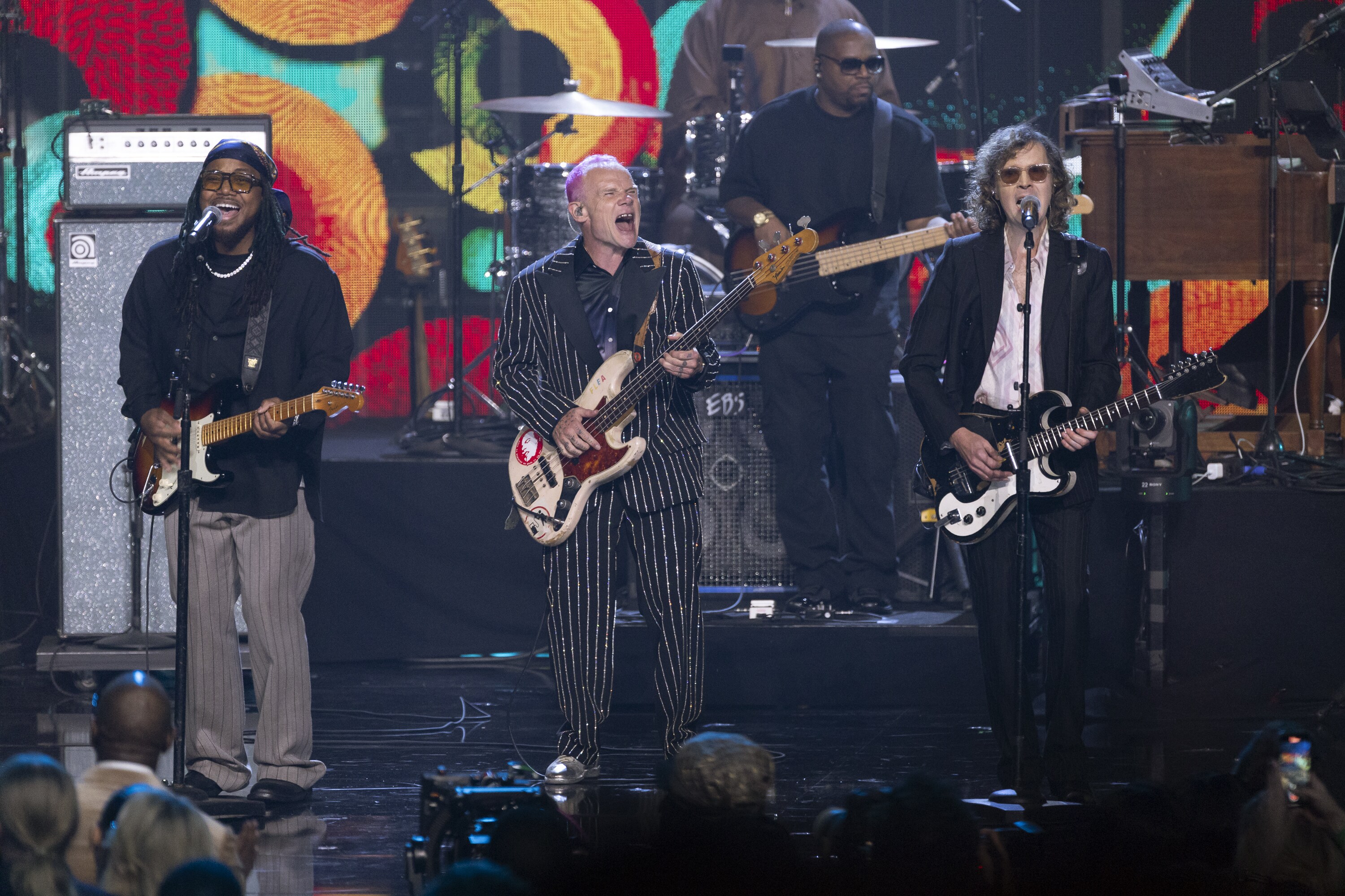 ROCK & ROLL HALL OF FAME 2025 INDUCTION CEREMONY – The 2025 Rock & Roll Hall of Fame Induction Ceremony, with once-in-a-lifetime performances and collaborations paying tribute to the iconic, generation-defining inductees, will be broadcast live coast to coast from Los Angeles on SATURDAY, NOV. 8 (8:00 p.m. EDT) on Disney+. (Disney/Frank Micelotta)  LEON THOMAS III, FLEA, BECK 