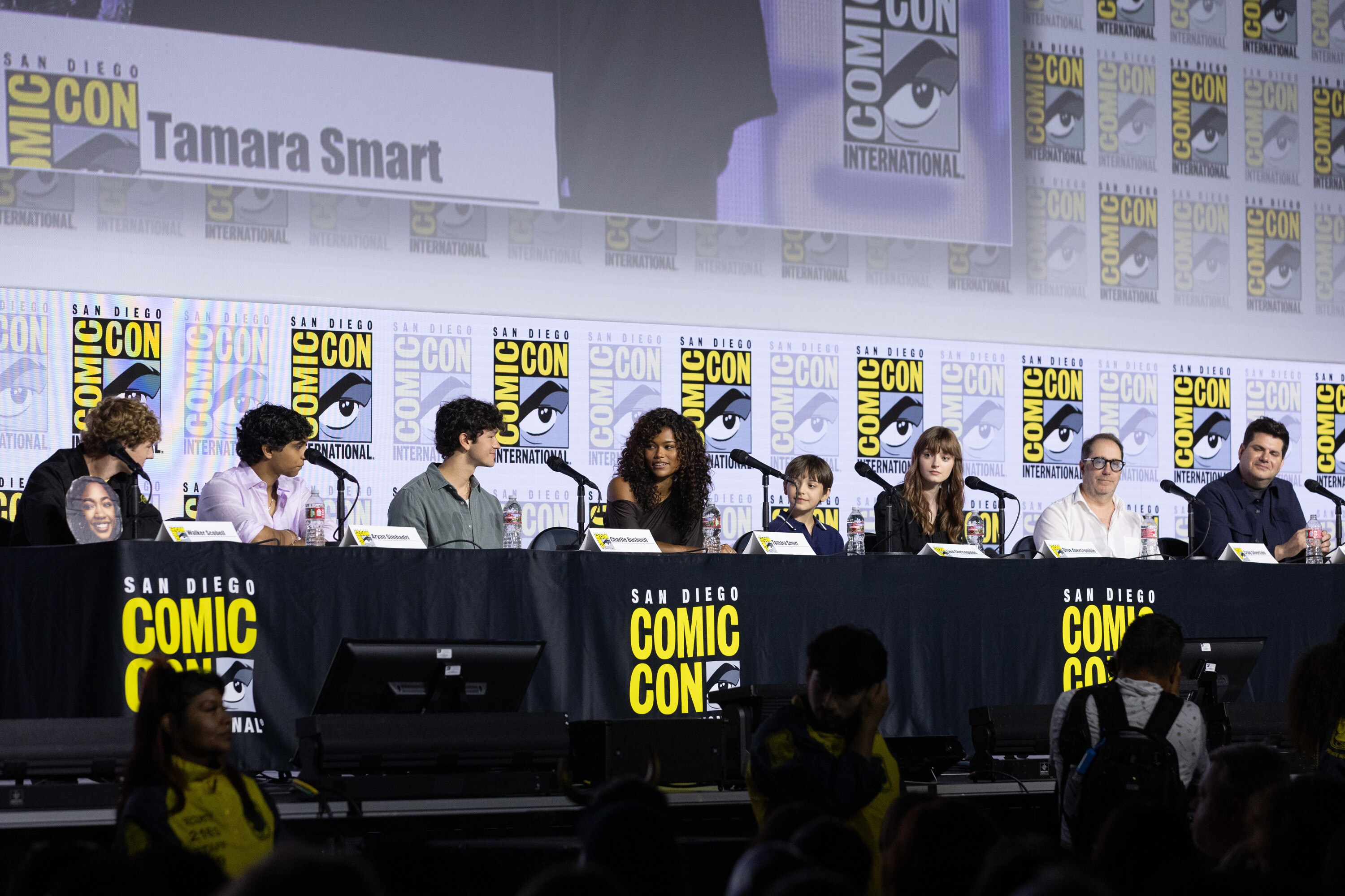 PERCY JACKSON AND THE OLYMPIANS - Series stars Walker Scobell, Aryan Simhadri, Charlie Bushnell, Tamara Smart, Levi Chrisopulos and Olive Abercrombie with Executive Producers Craig Silverstein and Dan Shotz share highlights from Season 3 of Disney+ Original series “Percy Jackson and the Olympians” during a Hall H panel, moderated by Juju Green on Thursday, July 23, 2026. (Disney/Stewart Cook)     WALKER SCOBELL, ARYAN SIMHADRI, CHARLIE BUSHNELL, TAMARA SMART, LEVI CHRISOPULOS, OLIVE ABERCROMBIE, CRAIG SILVERSTEIN, DAN SHOTZ