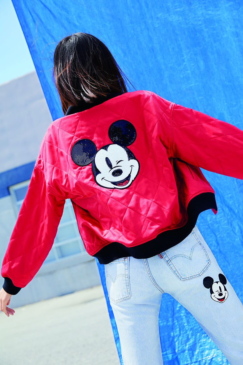 Bright red Levi Mickey Mouse jacket paired with Mickey Mouse denim jeans 