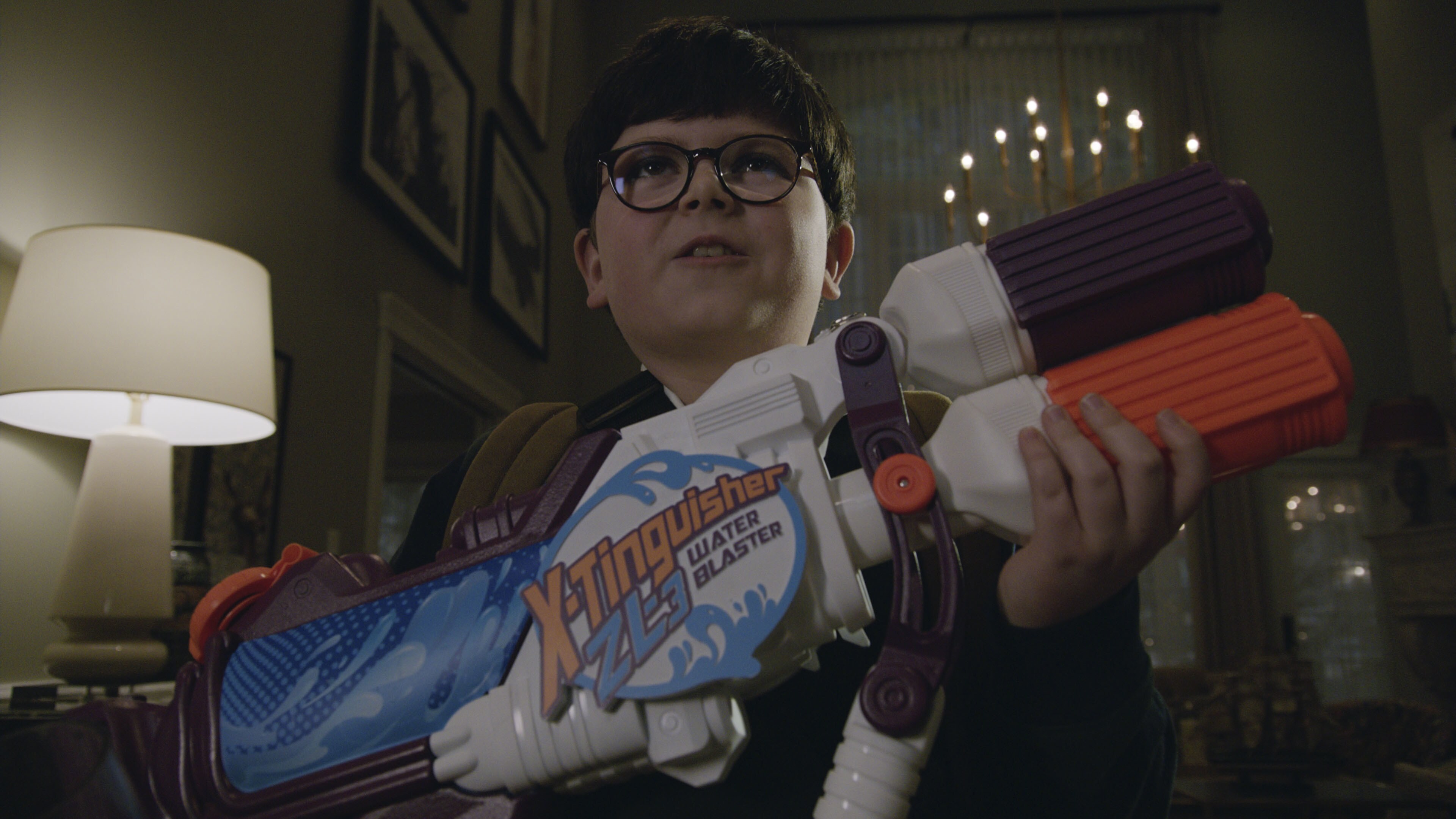 Max Holds an Ultra Blaster Water Gun in Home Sweet Home Alone