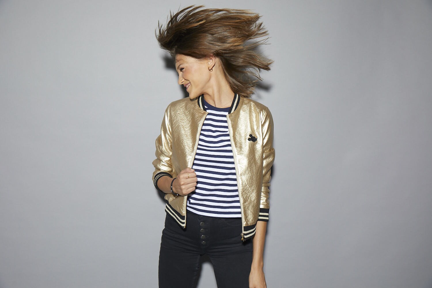 Model sporting a Mickey Mouse Gold jacket
