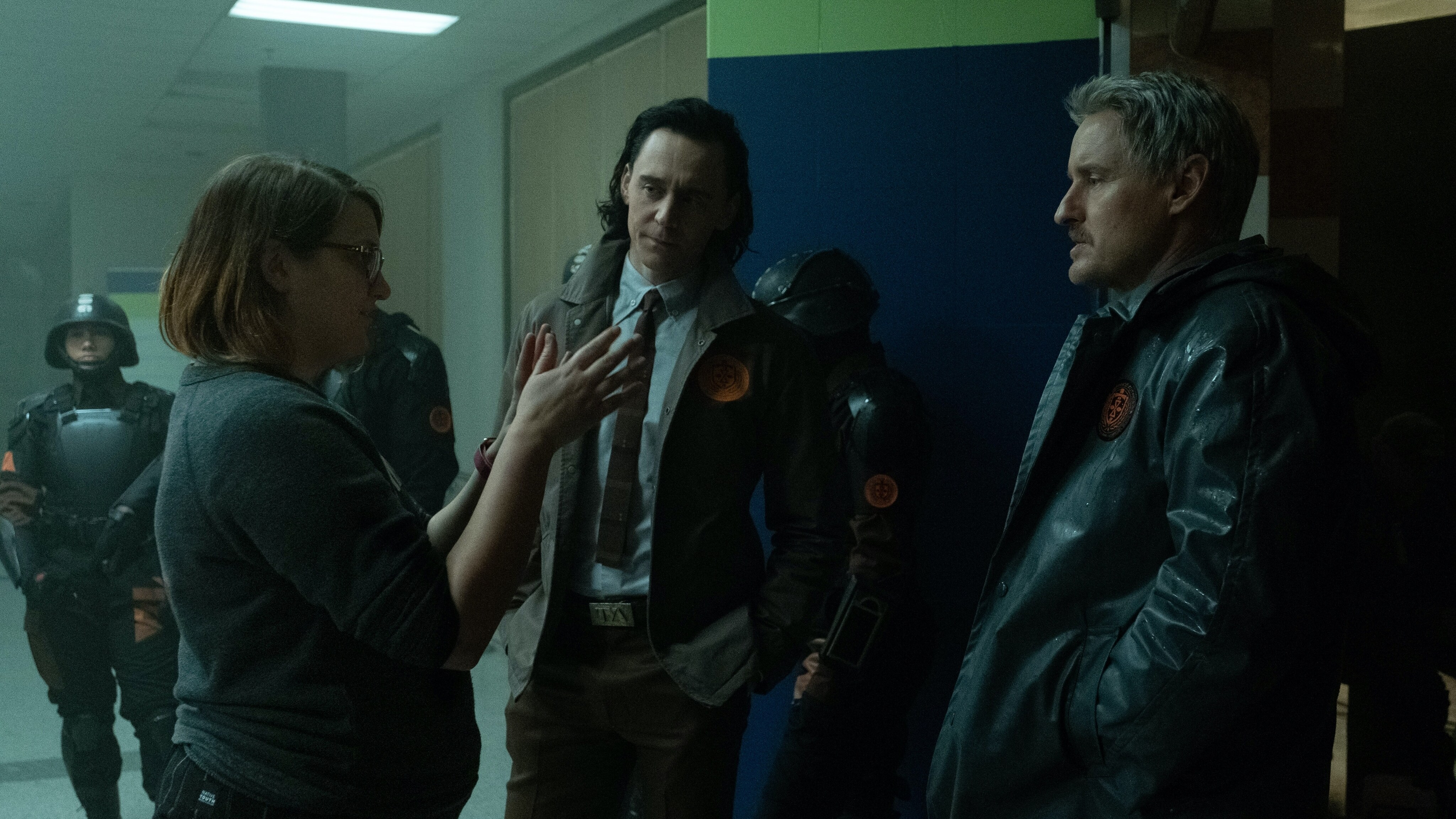 (L-R): Director Kate Herron, Tom Hiddleston and Owen Wilson on the set of Marvel Studios' LOKI, exclusively on Disney+. Photo by Chuck Zlotnick. ©Marvel Studios 2021. All Rights Reserved.
