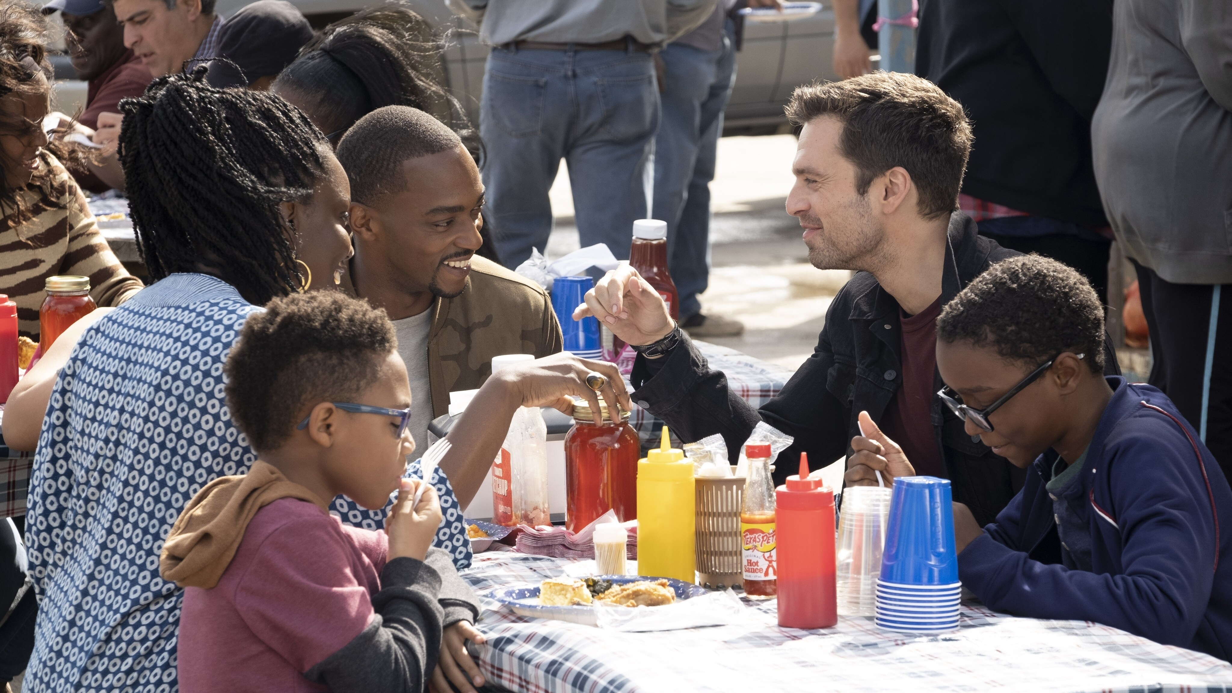 (L-R): Sarah Wilson (Adepero Oduye), Falcon/Sam Wilson (Anthony Mackie) and Winter Soldier/Bucky Barnes (Sebastian Stan) in Marvel Studios' THE FALCON AND THE WINTER SOLDIER exclusively on Disney+. Photo by Chuck Zlotnick. ©Marvel Studios 2021. All Rights Reserved.