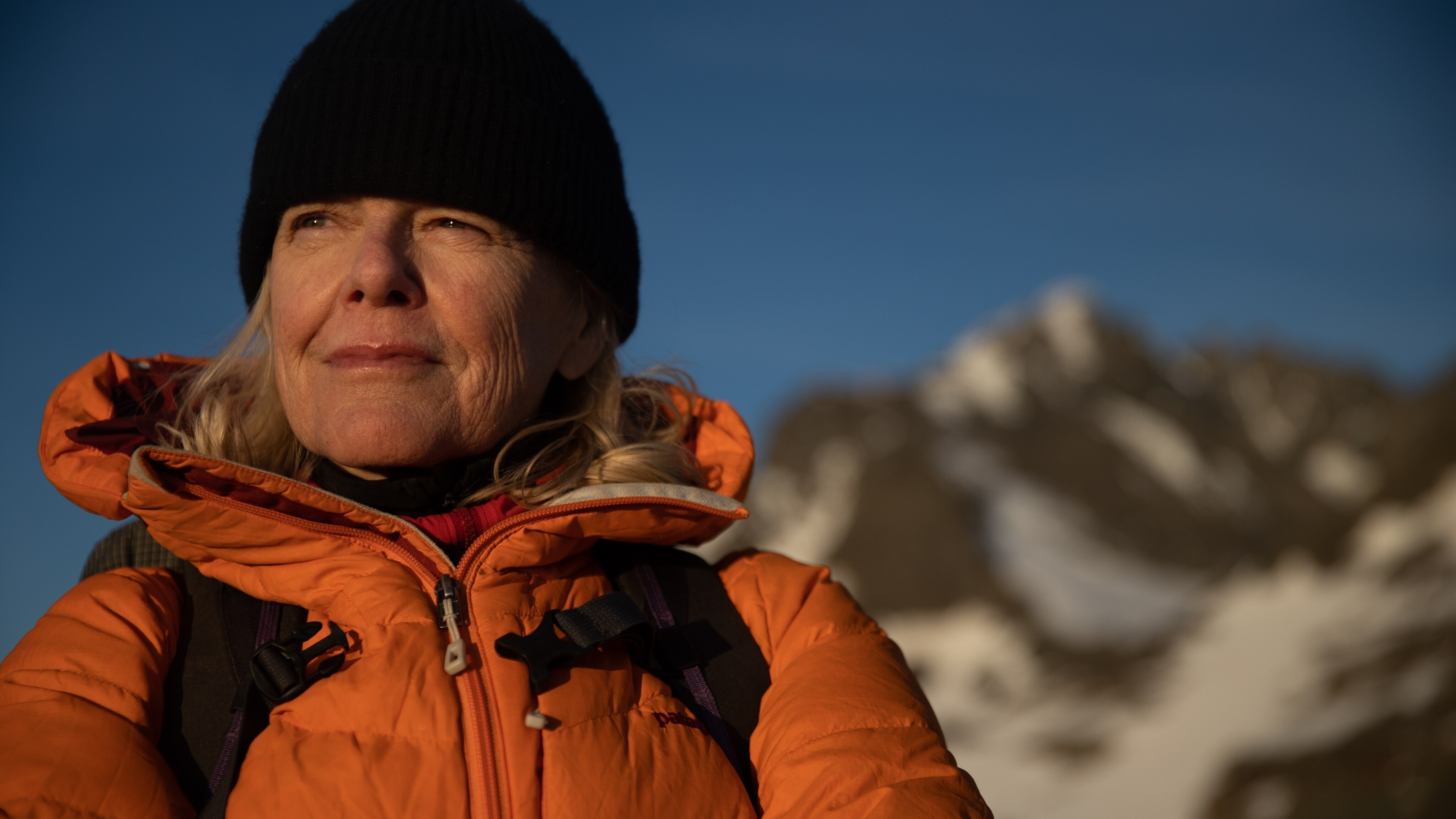 Kris Tompkins, gives a self-reflective and determined gaze as a Chilean sunset illuminates her face. (Jimmy Chin)