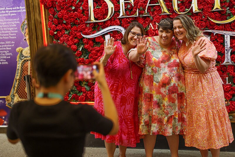 Some fans pose outside a relaxed performance of Beauty and the Beast at Queensland Performing Arts Centre